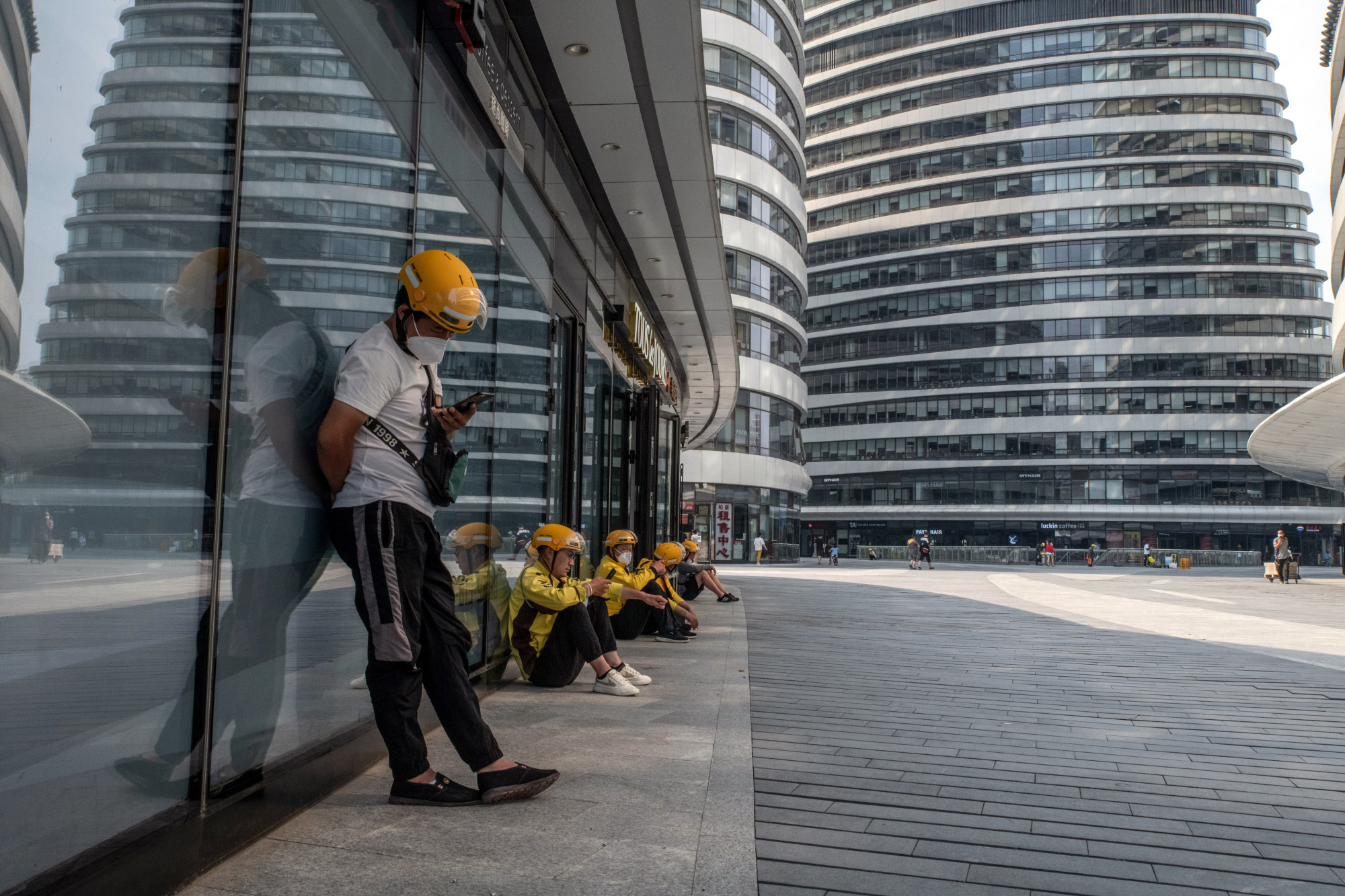Some WeChat users said they could not pay for lunch orders on Meituan, the on-demand delivery platform whose drivers wear yellow uniforms. Photo: Bloomberg