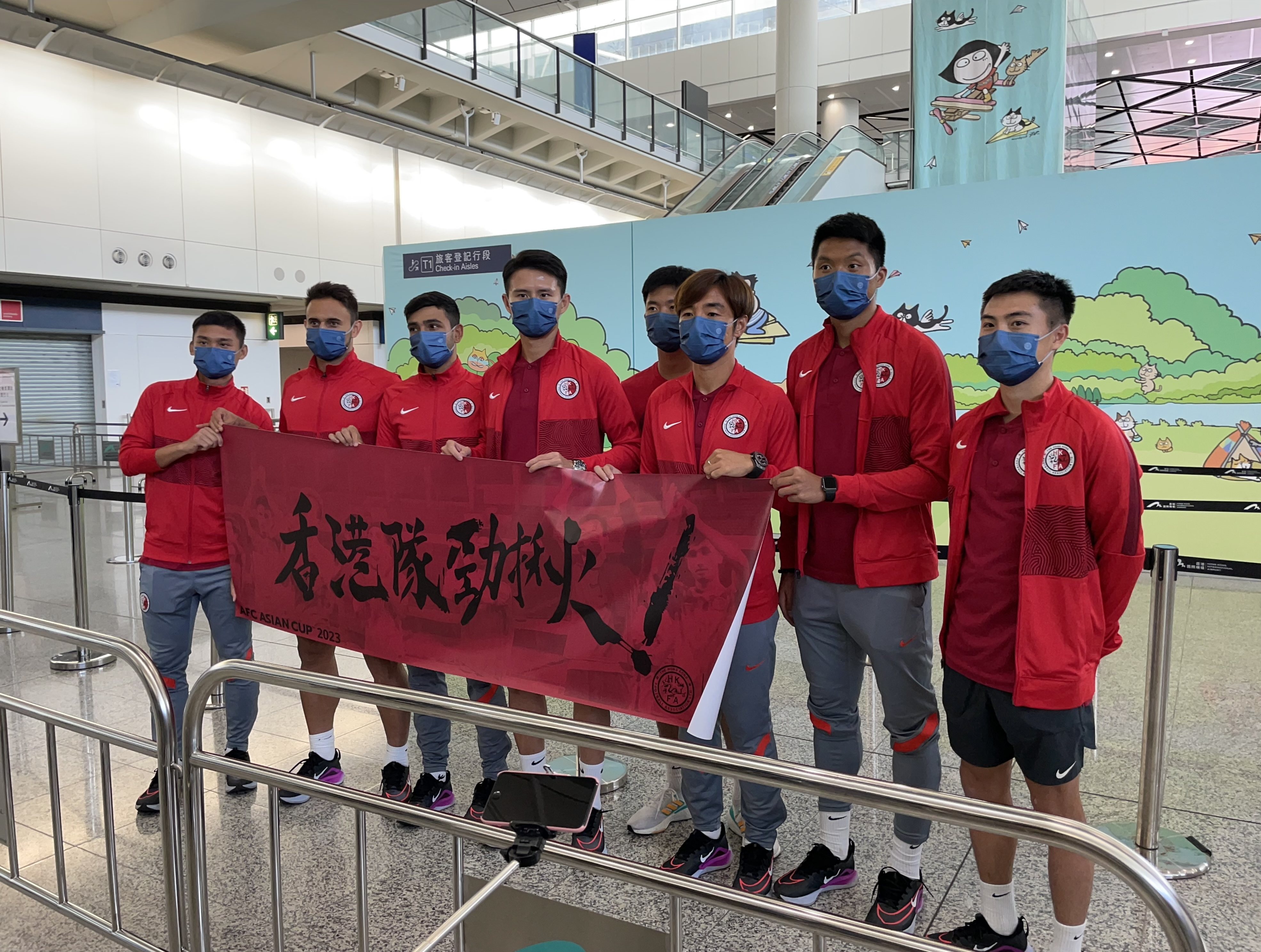 The eight players who completed the journey back from India arrive at Hong Kong airport. Photo: Chan Kin-wa
