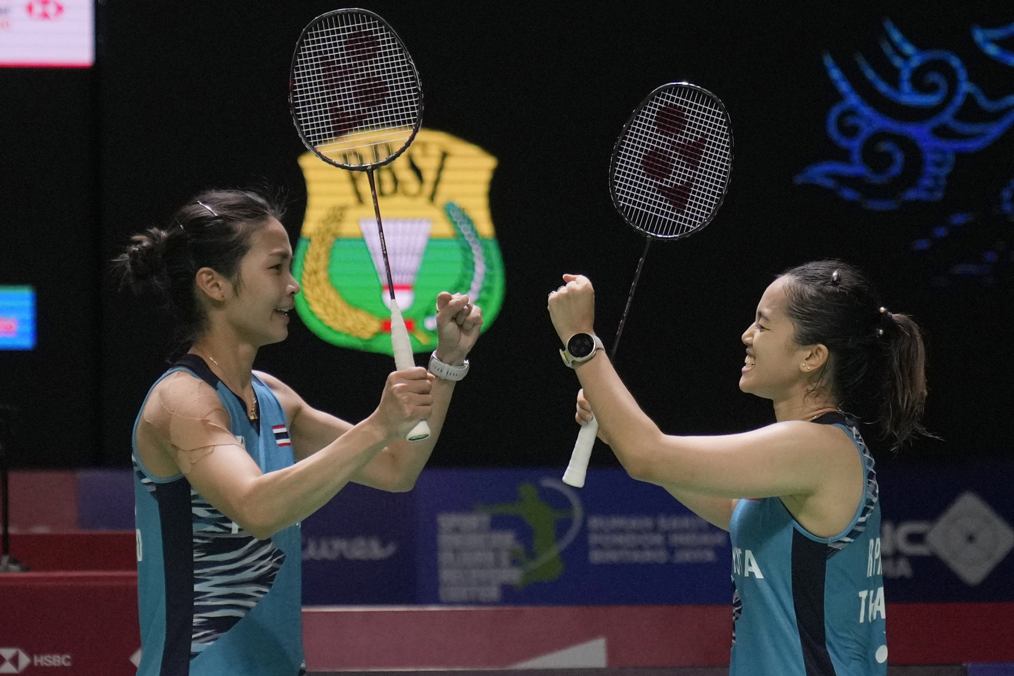 Jongkolphan Kithitharakul (left) and Rawinda Prajongjai of Thailand celebrate after defeating China’s Chen Qingchen and Jia Yifan, the world No 1 pair and Tokyo Olympic champions, at the Indonesia Open. Photo: AP