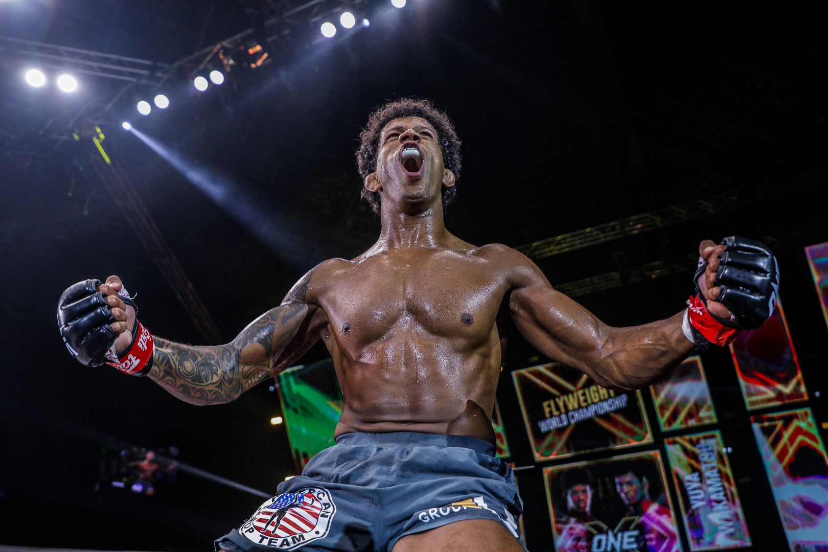 Adriano Moraes celebrates on top of the cage after beating Yuya Wakamatsu. Photos: ONE Championship.