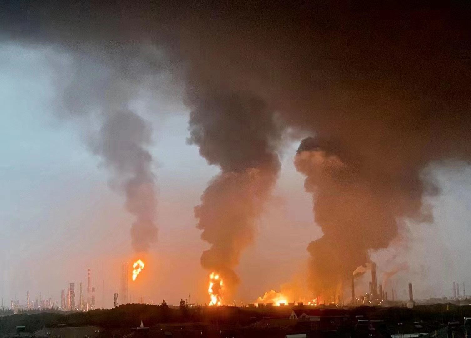 Flames and smoke billow from the ethylene glycol plant area of Sinopec Shanghai Petrochemical. Photo: Xinhua 