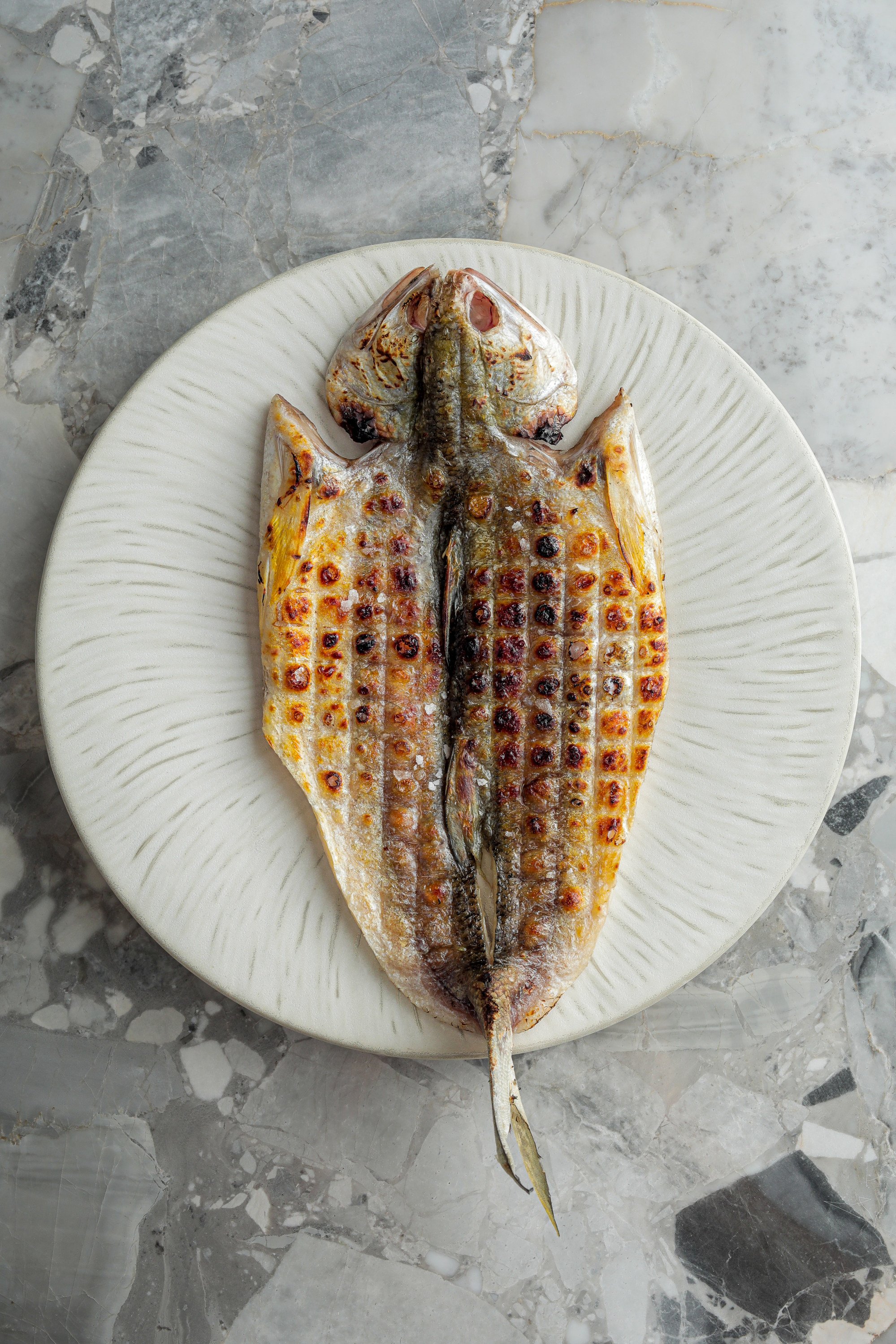 At Fireside in Central, threadfin is aged for 3-4 days before being grilled. Photo: Fireside