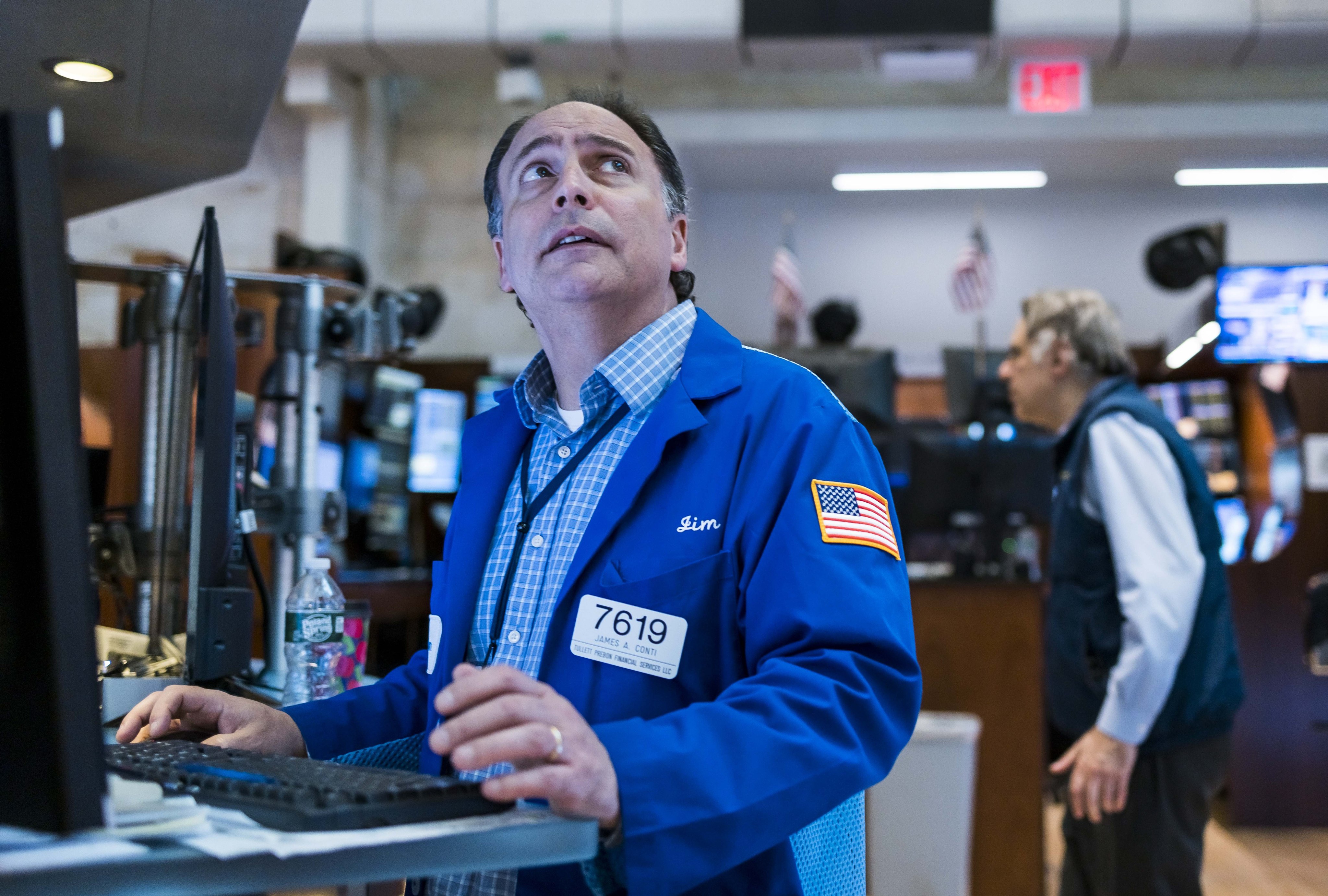 Traders working on the floor of the New York Stock Exchange watch news of the US Federal Reserve’s decision to raise interest rates on June 15. Photo: EPA-EFE