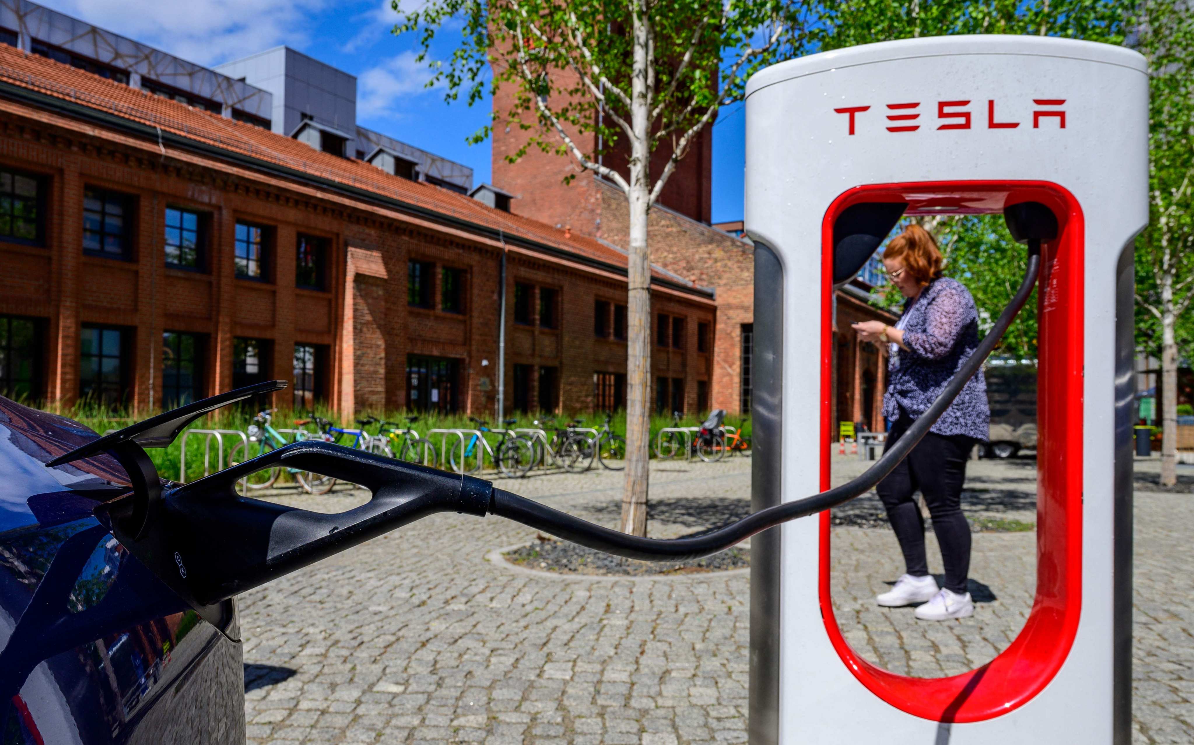 A Tesla electric car is charged in Berlin on May 27. Tesla, a company at the forefront of making technological breakthroughs to reduce the use of fossil fuels, has been dropped from the S&P 500 ESG index. Photo: AFP 