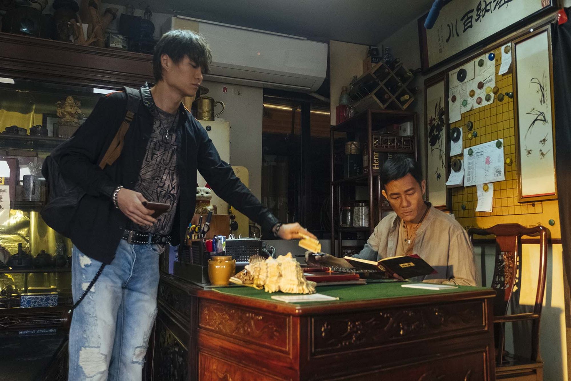 Hubert Wu (left) and Eddie Cheung (right) play an aspiring entrepreneur and his domineering father in a still from Look Up.