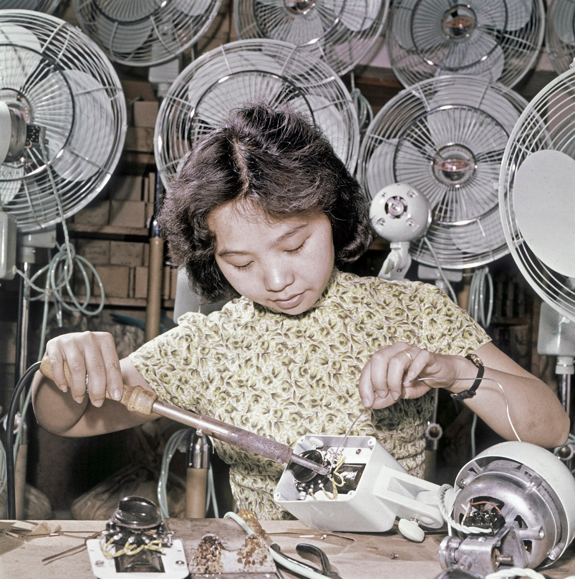 A woman makes electric fans in a factory in Hong Kong, an image on display at the Hong Kong Maritime Museum. Photo: Hong Kong Maritime Museum