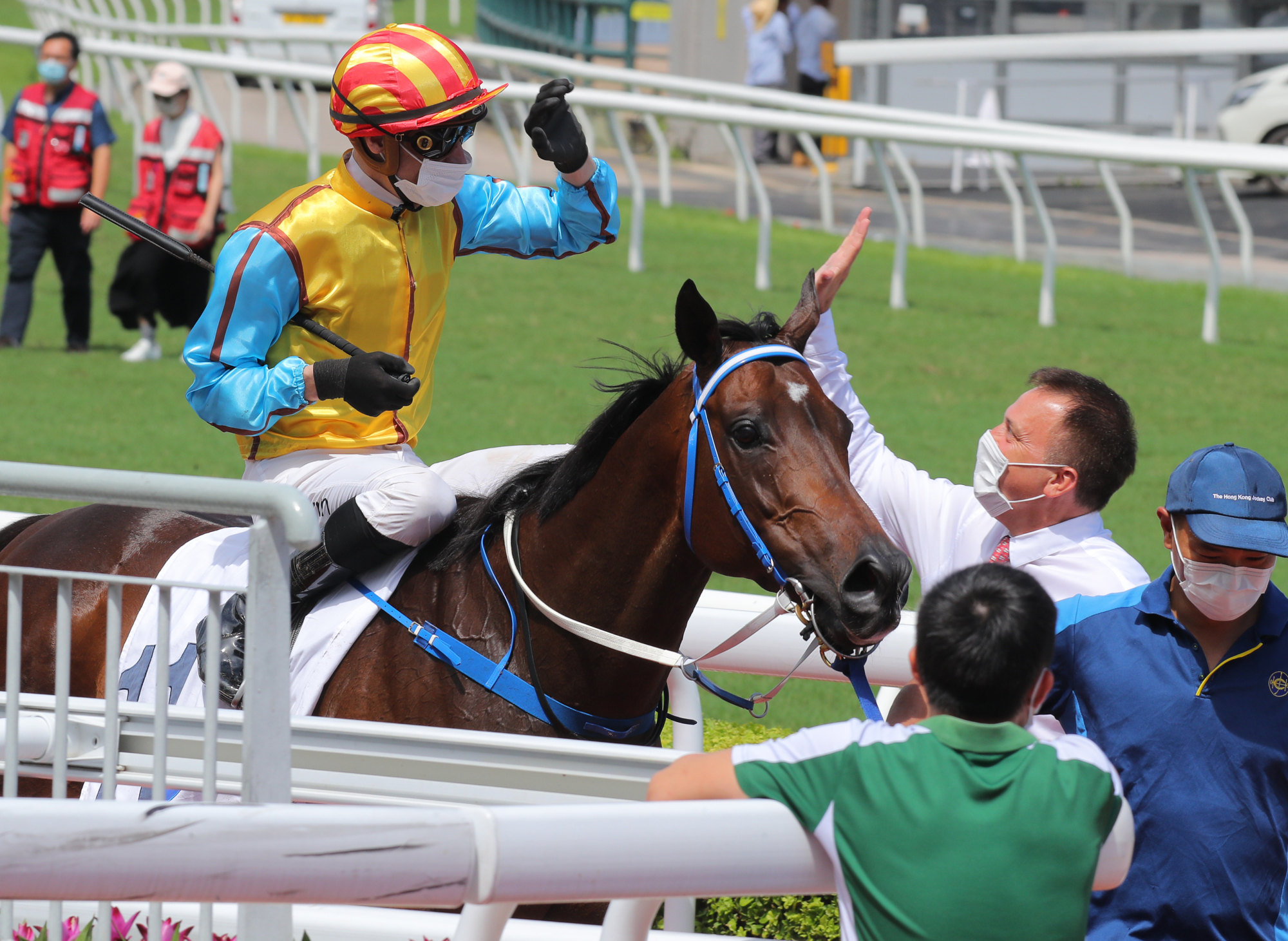 Jockey Blake Shinn and trainer Caspar Fownes high five after Nunchuks’ victory on Saturday.