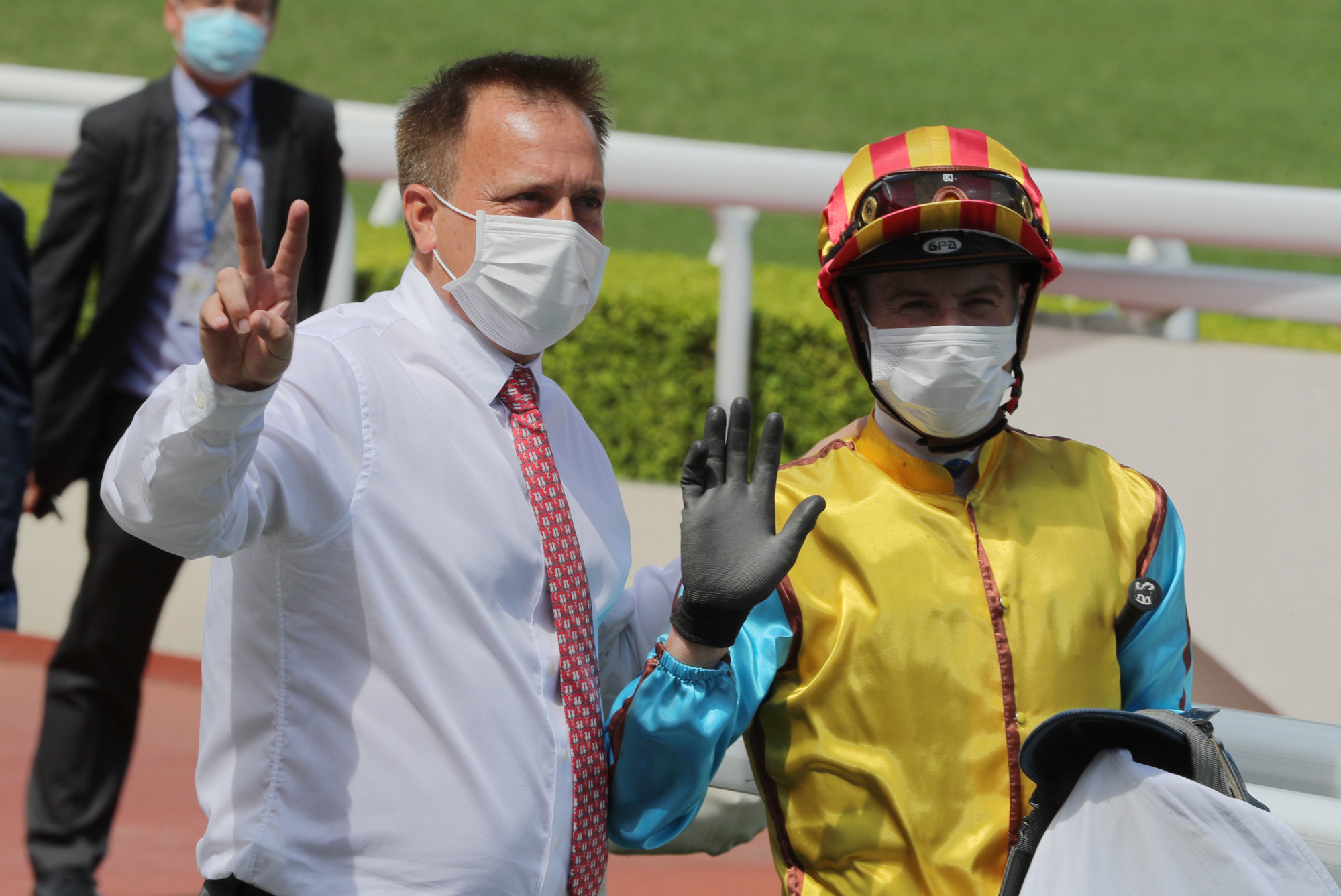 Caspar Fownes and Blake Shinn celebrate the win of Nunchuks at Sha Tin.