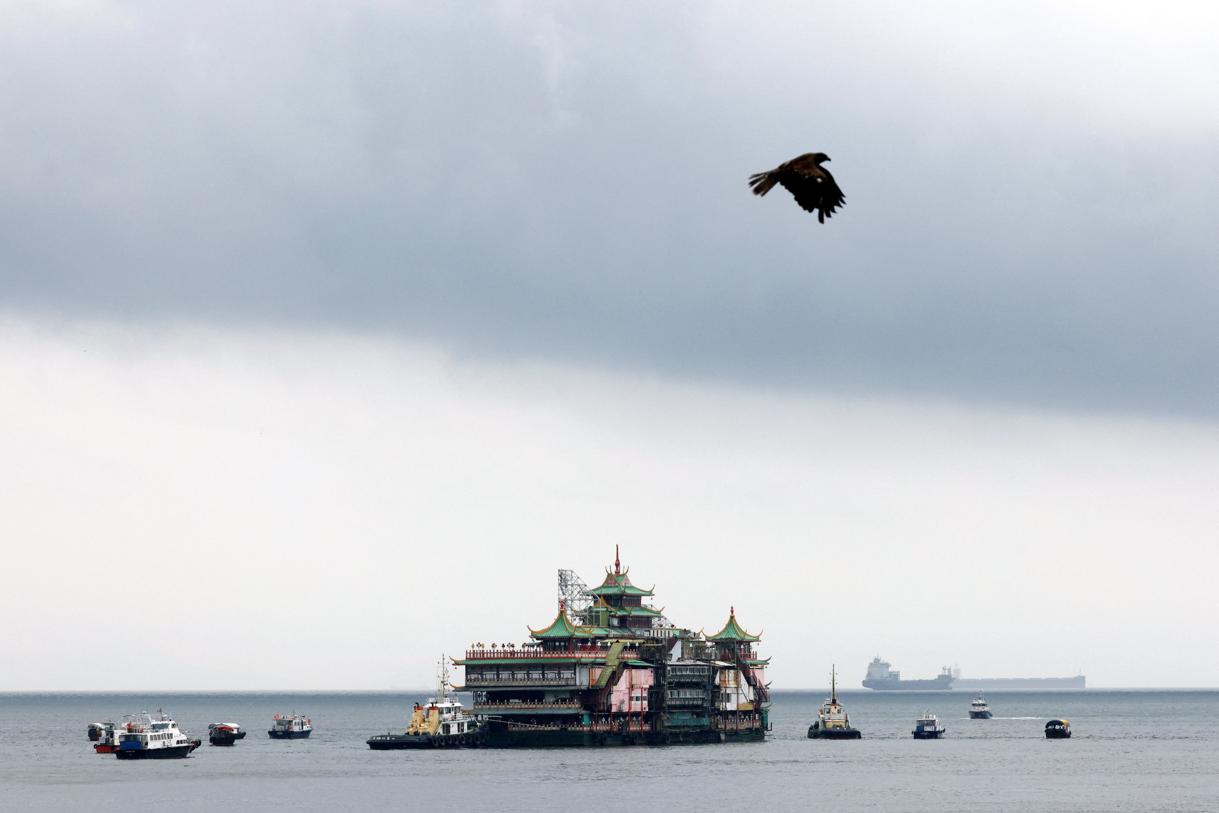 The floating restaurant heads off on its ill-fated journey. Photo: Reuters