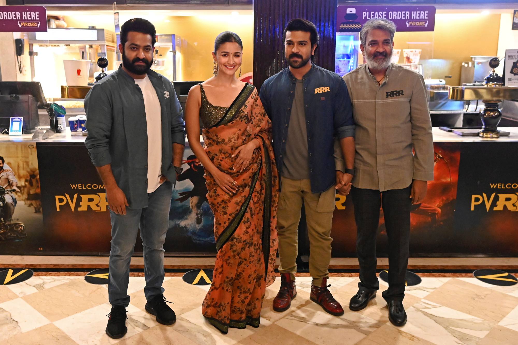 Indian actors Jnr NTR, Alia Bhatt, Ram Charan and director SS Rajamouli at a promotional event for their film ‘RRR’. Photo: AFP