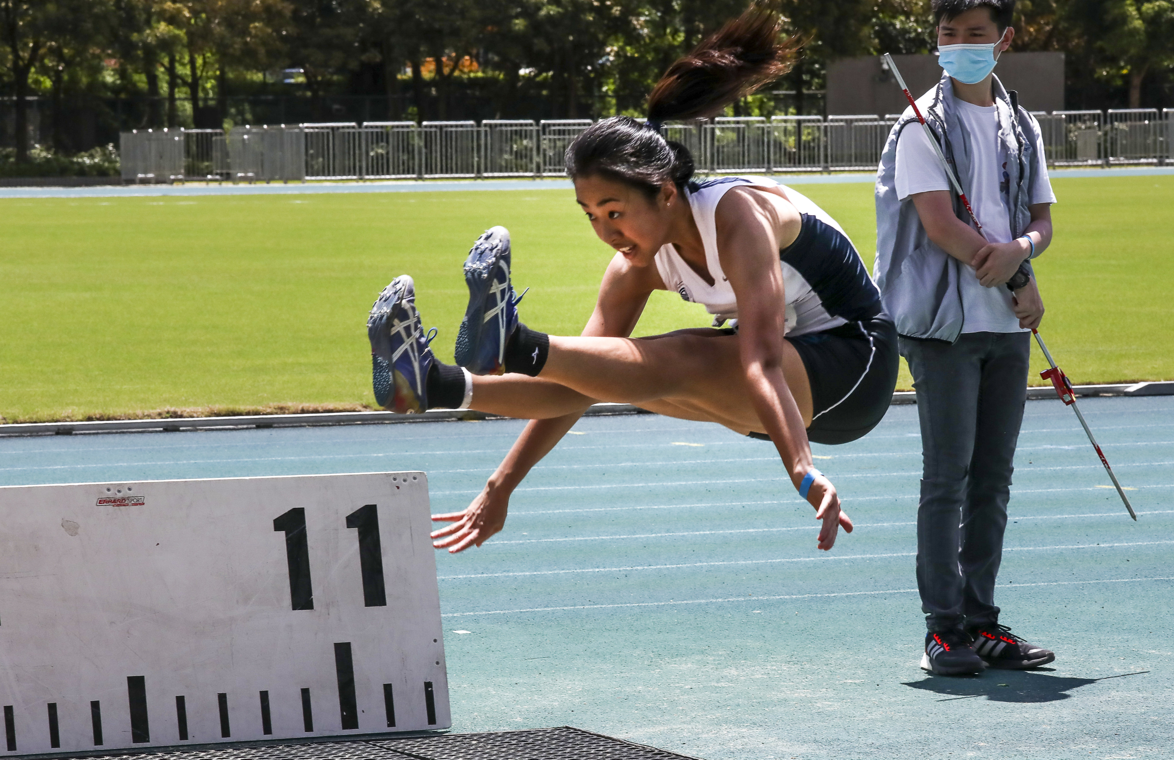 Triple-jumper Shannon Chan on her way to victory at the Hong Kong Athletics Championships on Sunday. Photo: Jonathan Wong