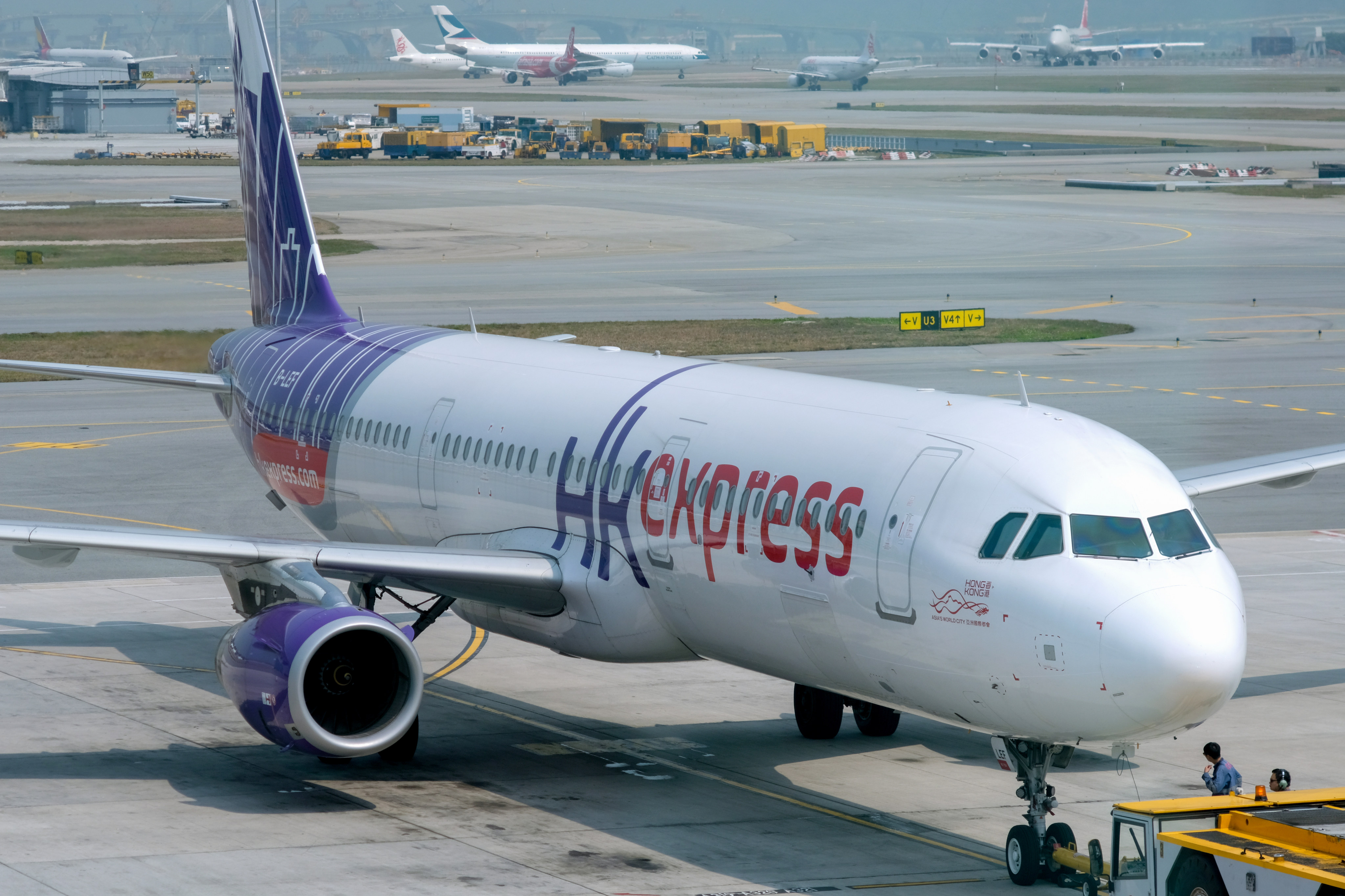 A HK Express plane landed in Hong Kong International Airport with smoke billowing from the aircraft on Monday afternoon. Photo: Fung Chang