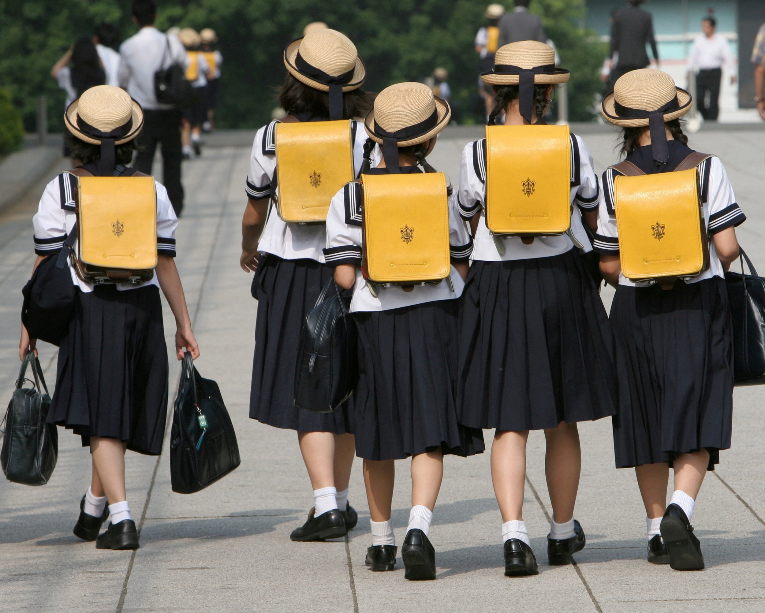Children walk home from school in Tokyo. Photo: Reuters
