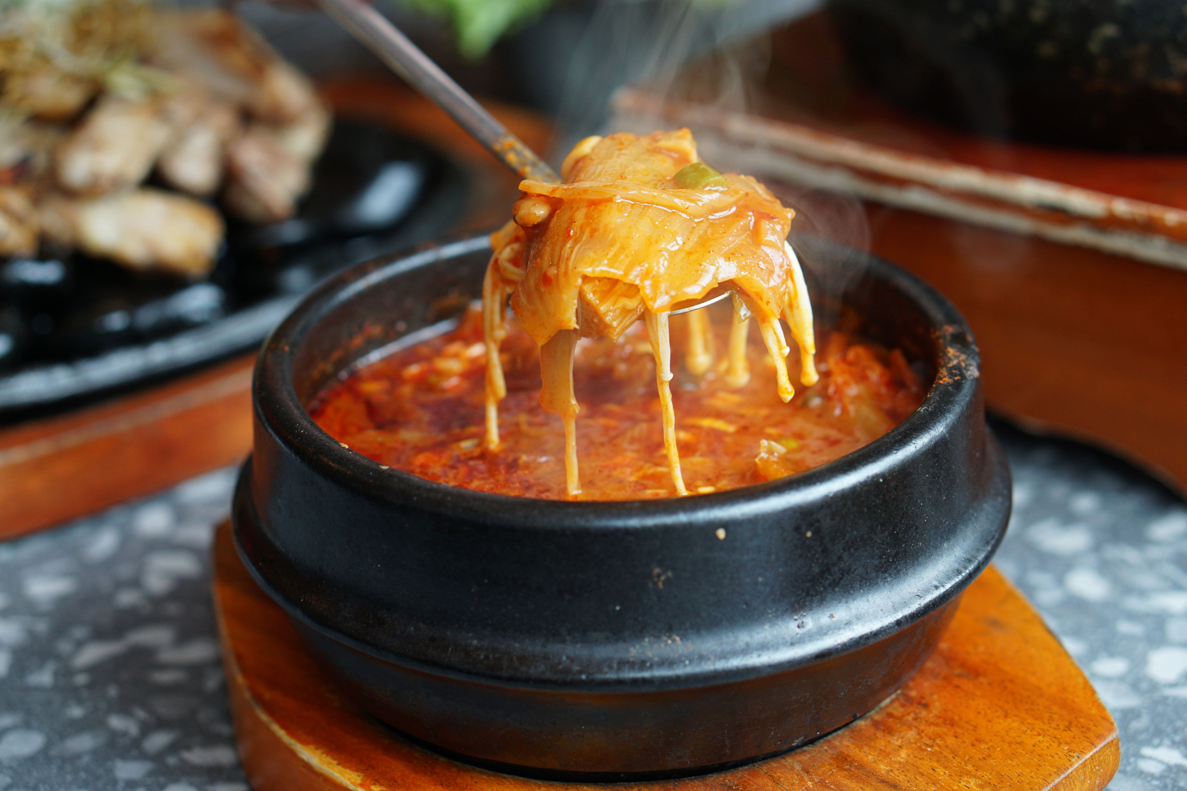 Kimchi soup with tofu and pork belly served in clay pot, one of the most loved of all the stews in Korean cuisine. Photo: Shutterstock