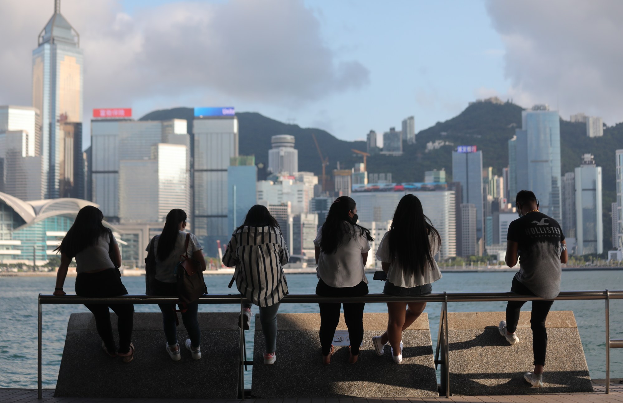 People take in the view along the waterfront in Tsim Sha Tsui on April 24. Photo: Xiaomei Chen
