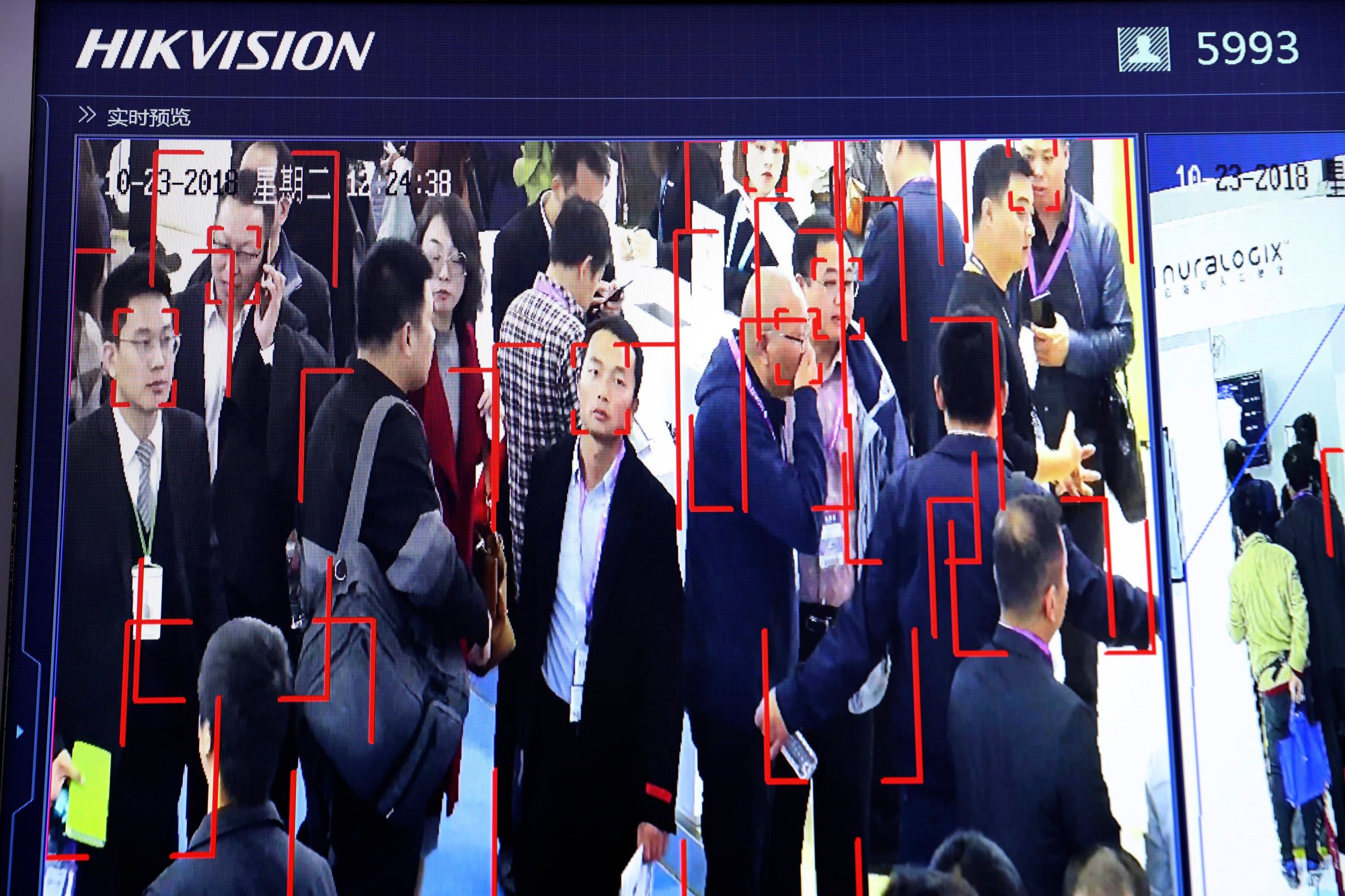 Visitors at a 2018 trade show in Beijing are tracked by facial recognition technology from state-owned surveillance equipment manufacturer Hikvision. Photo: AP