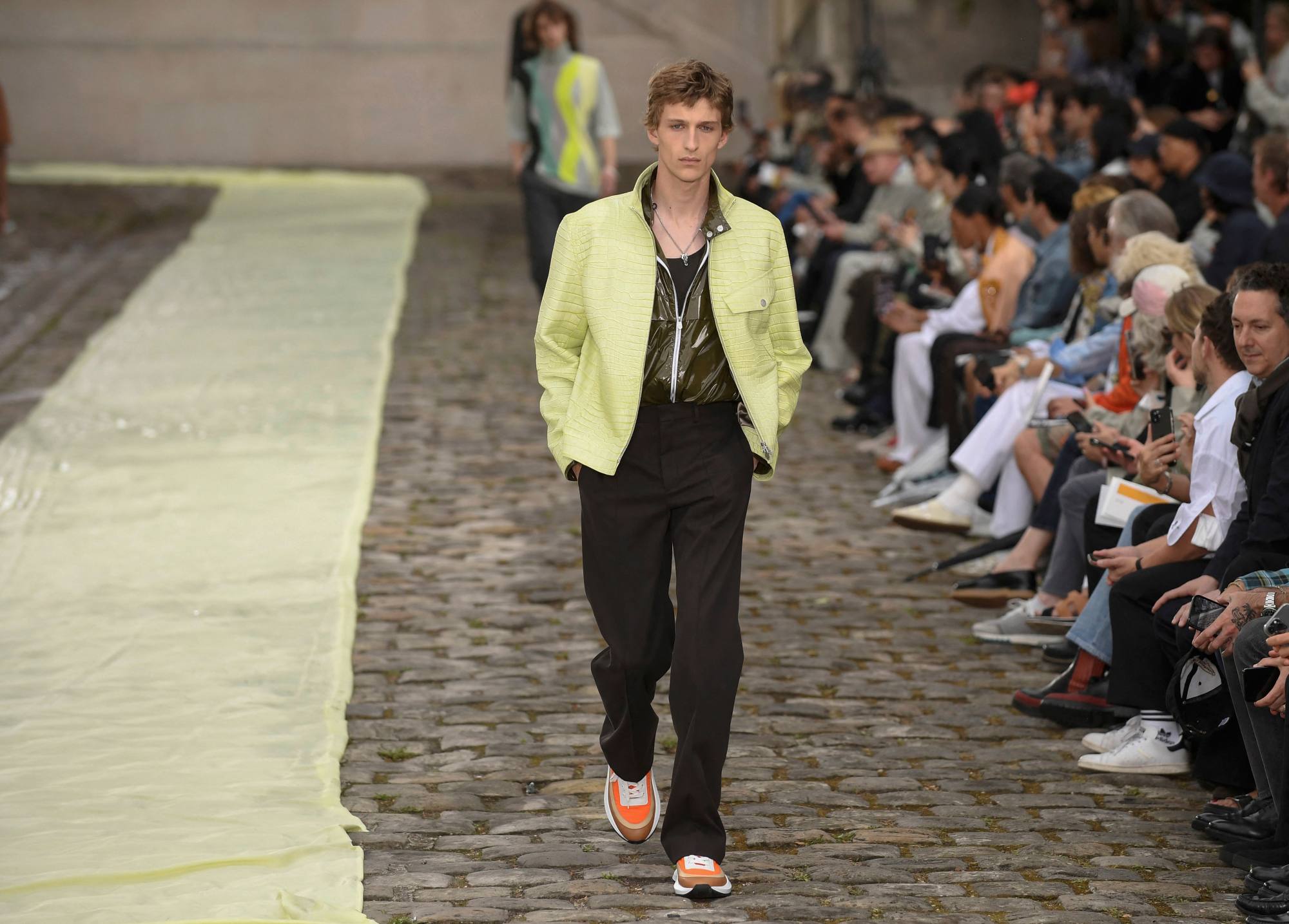 Hermès brought summer holiday vibes to Paris Fashion Week with pastel  colours and a contemporary take on Birkin's ancestor – the Haut à courroies  travel bag – for its menswear spring/summer 2023