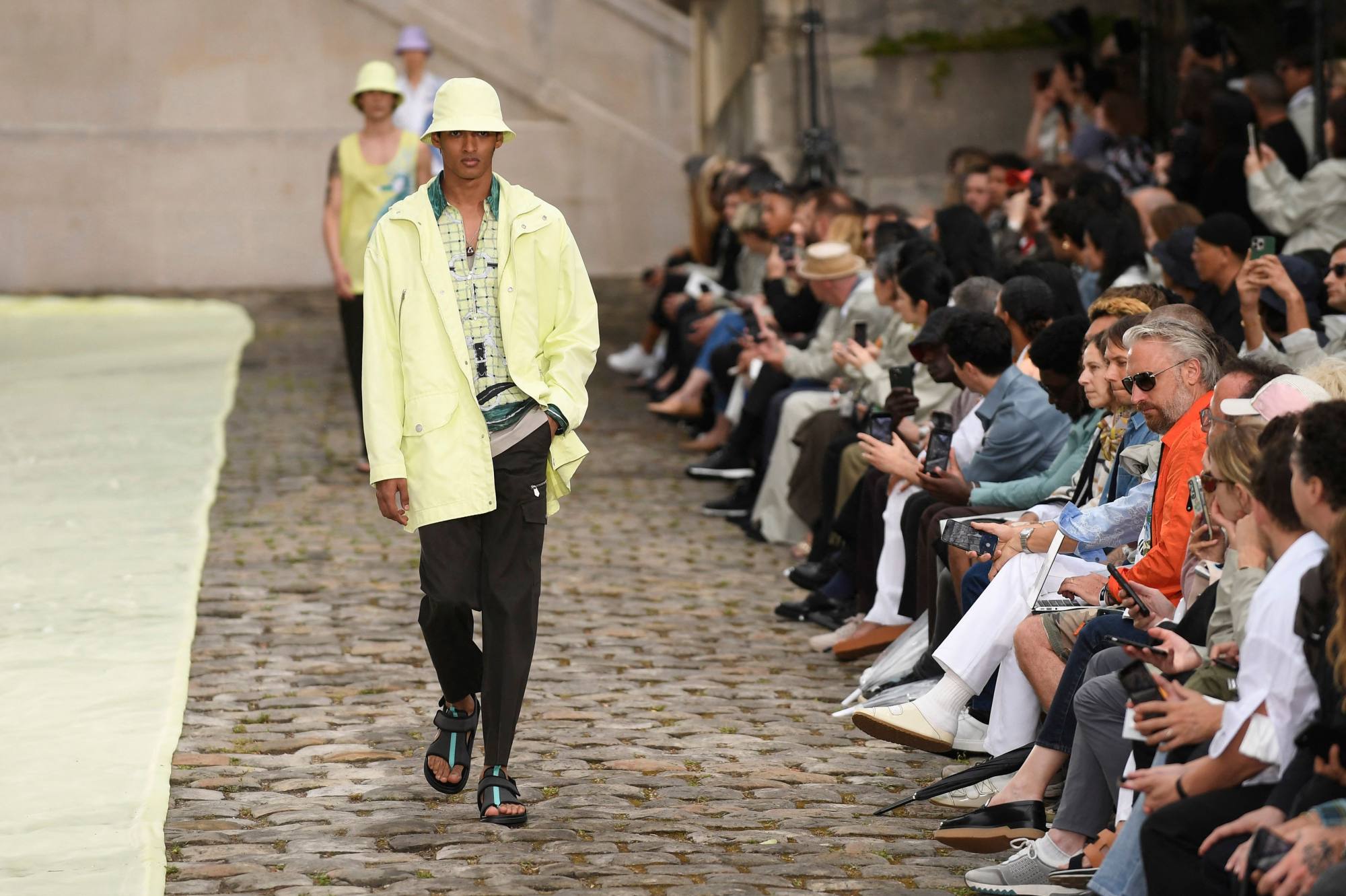 More pastel paired with black at Hermès’ menswear spring/summer 2023 show as part of Paris Fashion Week, in Paris, on June 25. Photo: AFP