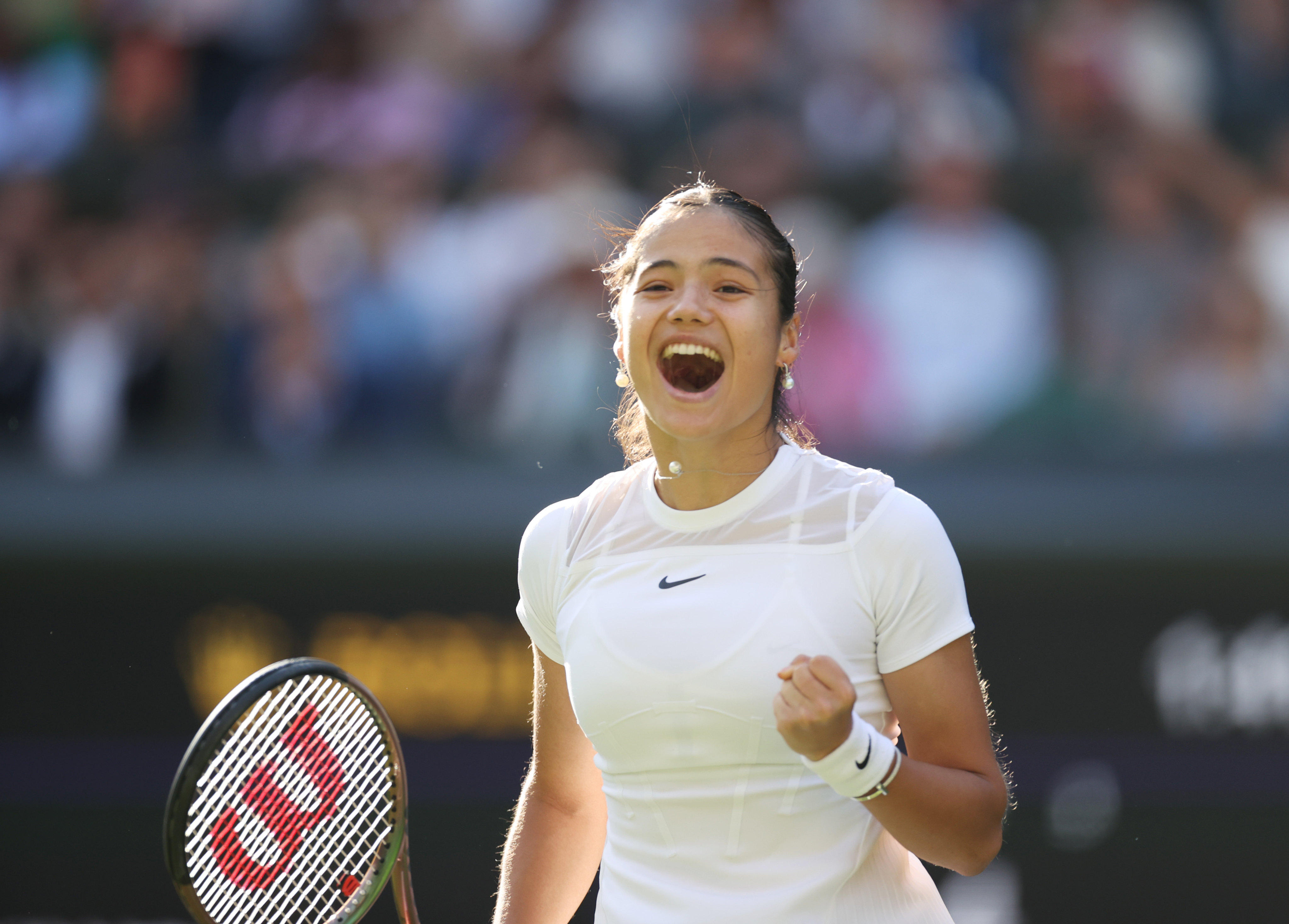 Emma Raducanu celebrates after winning her first-round match against Alison Van Uytvanck at Wimbledon. Photo: Xinhua/