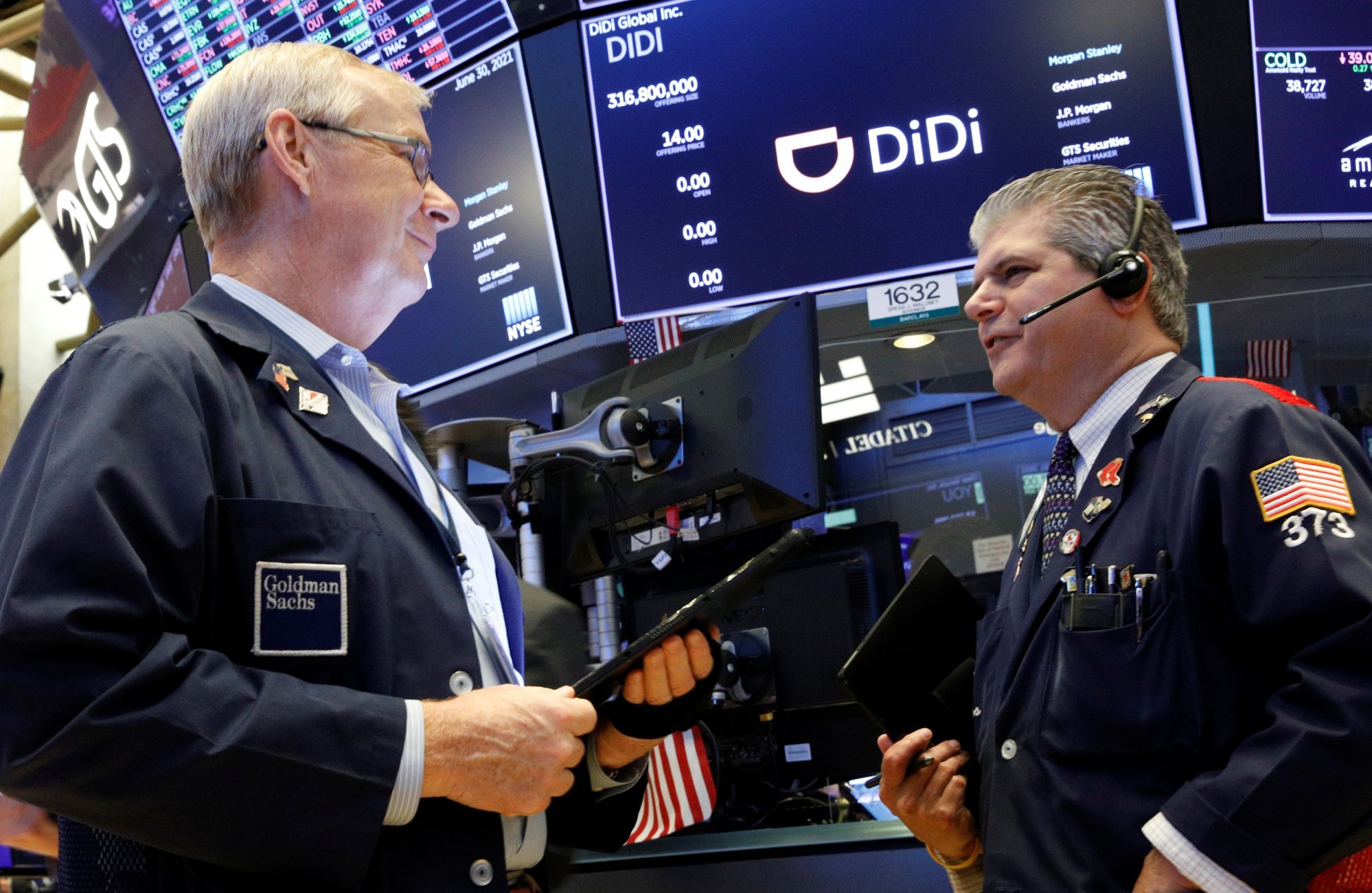 Traders work during the launch of Chinese ride-hailing company Didi Global Inc on the New York Stock Exchange on June 30, 2021. In May, the company’s shareholders voted to delist from the exchange. Photo: Reuters
