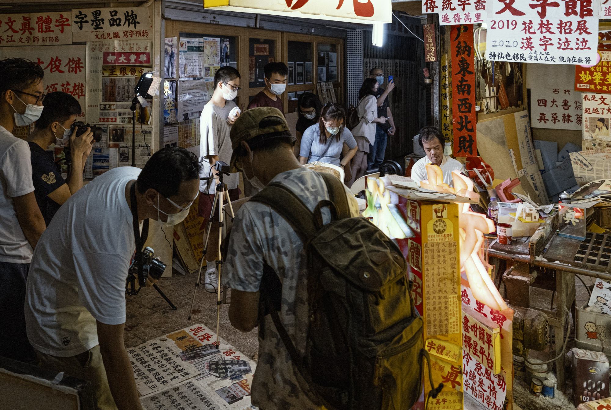 Shiu and his team capture images and conduct interviews with shopkeepers at the State Theatre in North Point. Photo: The Lost Metropolis