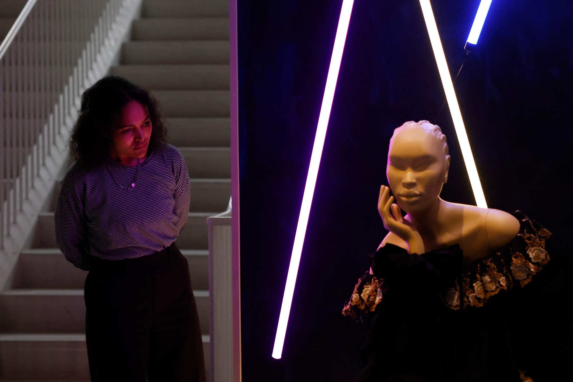 A museum worker next to “Irene dress” by Patience Torlowei. Photo: AFP