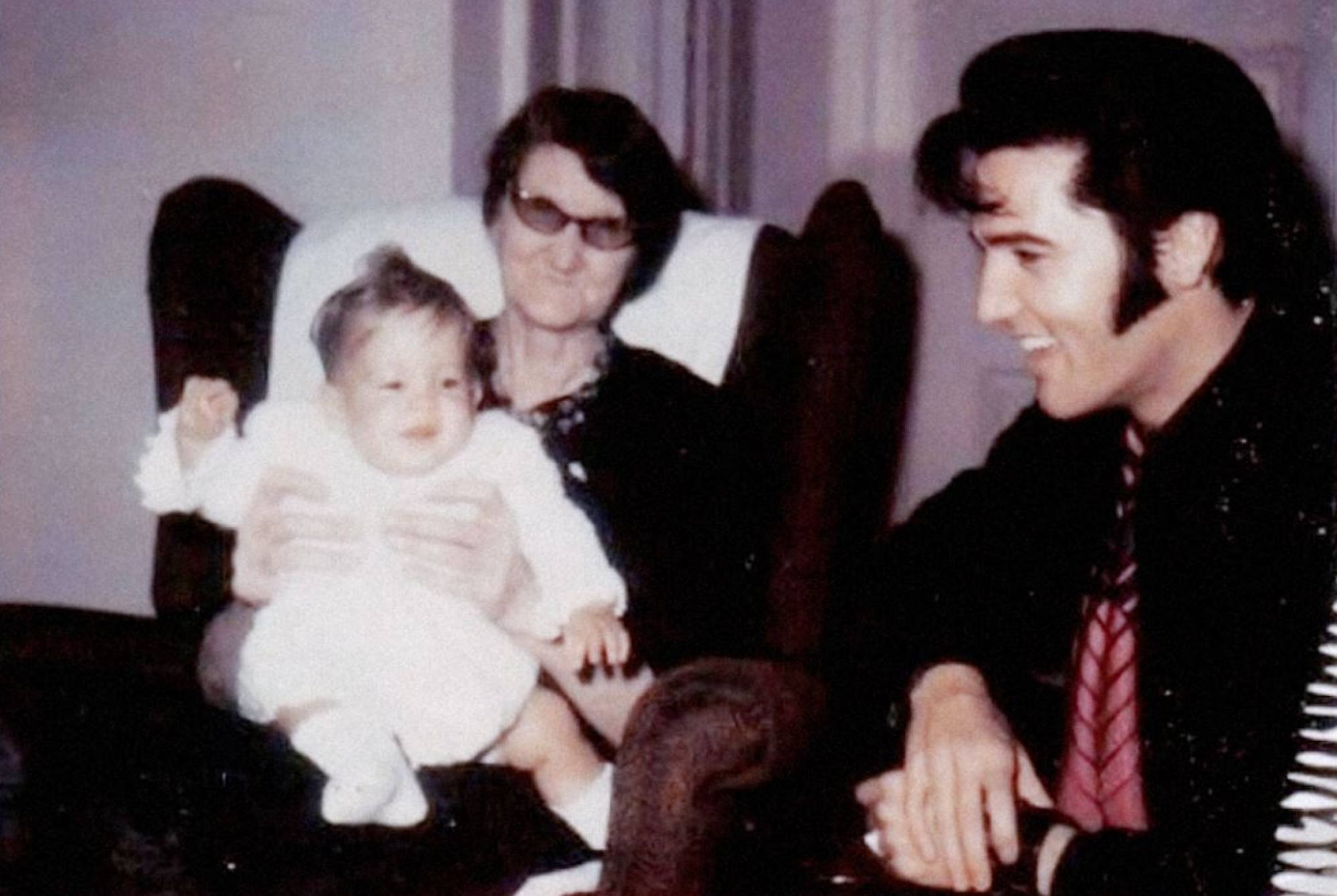Elvis Presley at Graceland with baby Lisa Marie and his grandmother, Minnie Mae Presley. Photo: @presleyarchive/Twitter