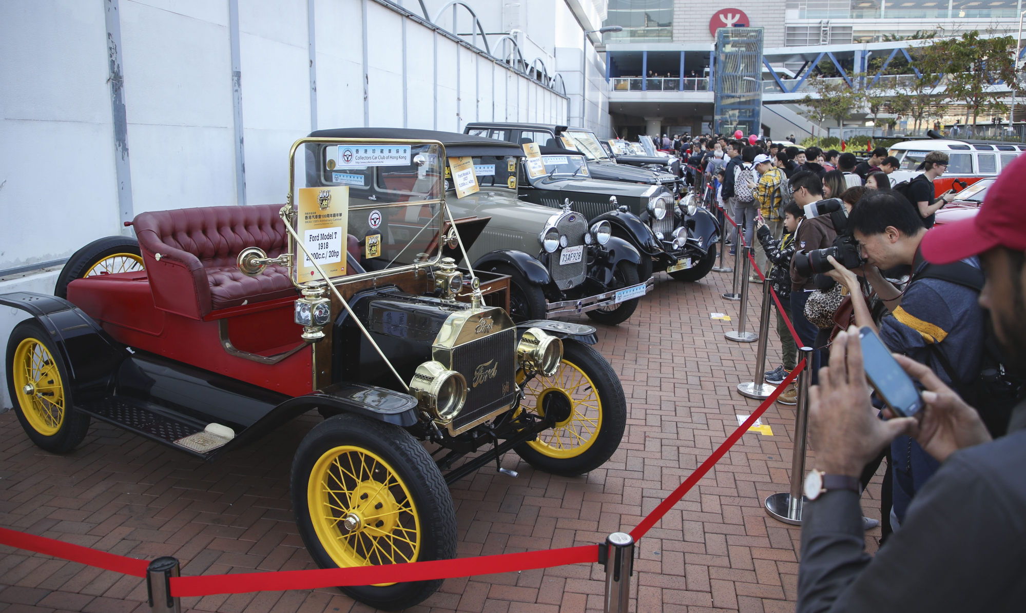 Visitors ogle classic rides during the Automobile Association 100th anniversary carnival held at Edinburgh Place in Central in 2018. Photo: Edward Wong