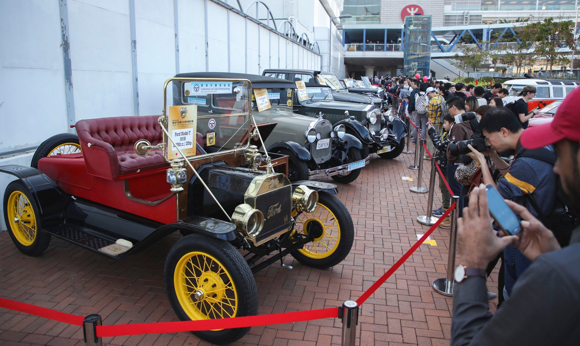 Visitors ogle classic rides during the Automobile Association 100th anniversary carnival held at Edinburgh Place in Central in 2018. Photo: Edward Wong