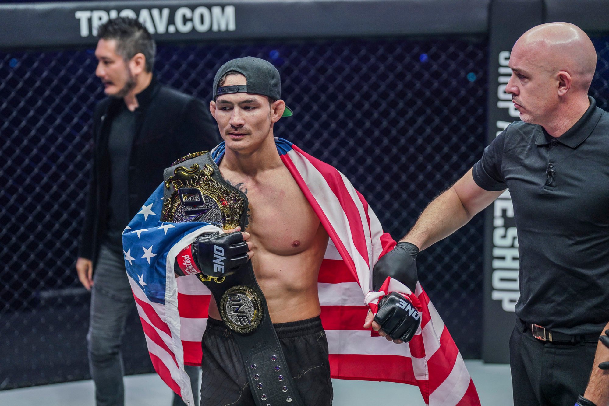 Thanh Le celebrates with his ONE featherweight MMA title after knocking out Garry Tonon.