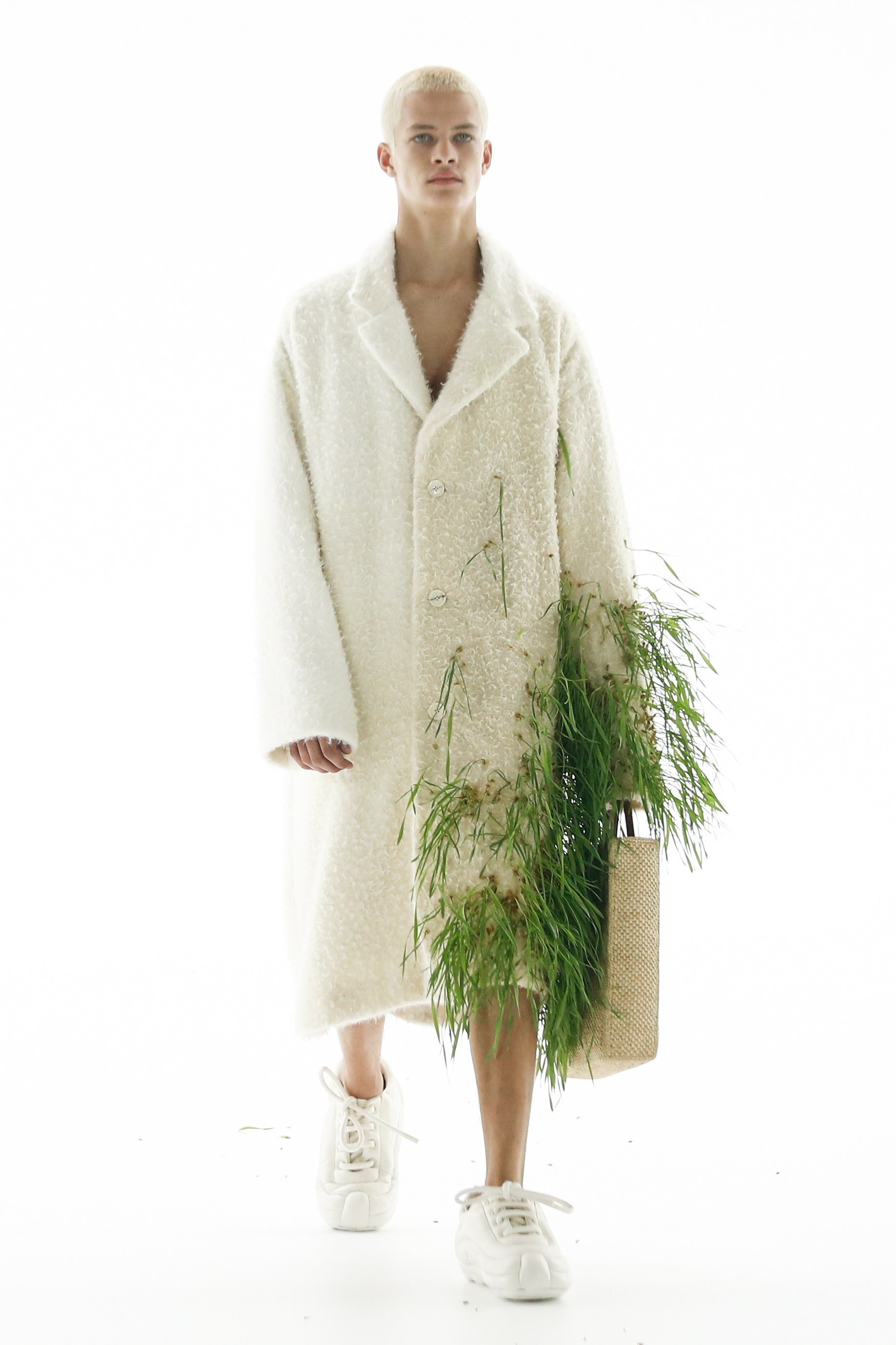 Loewe sprouts grasses and plants from sodden clothes at Paris Fashion Week