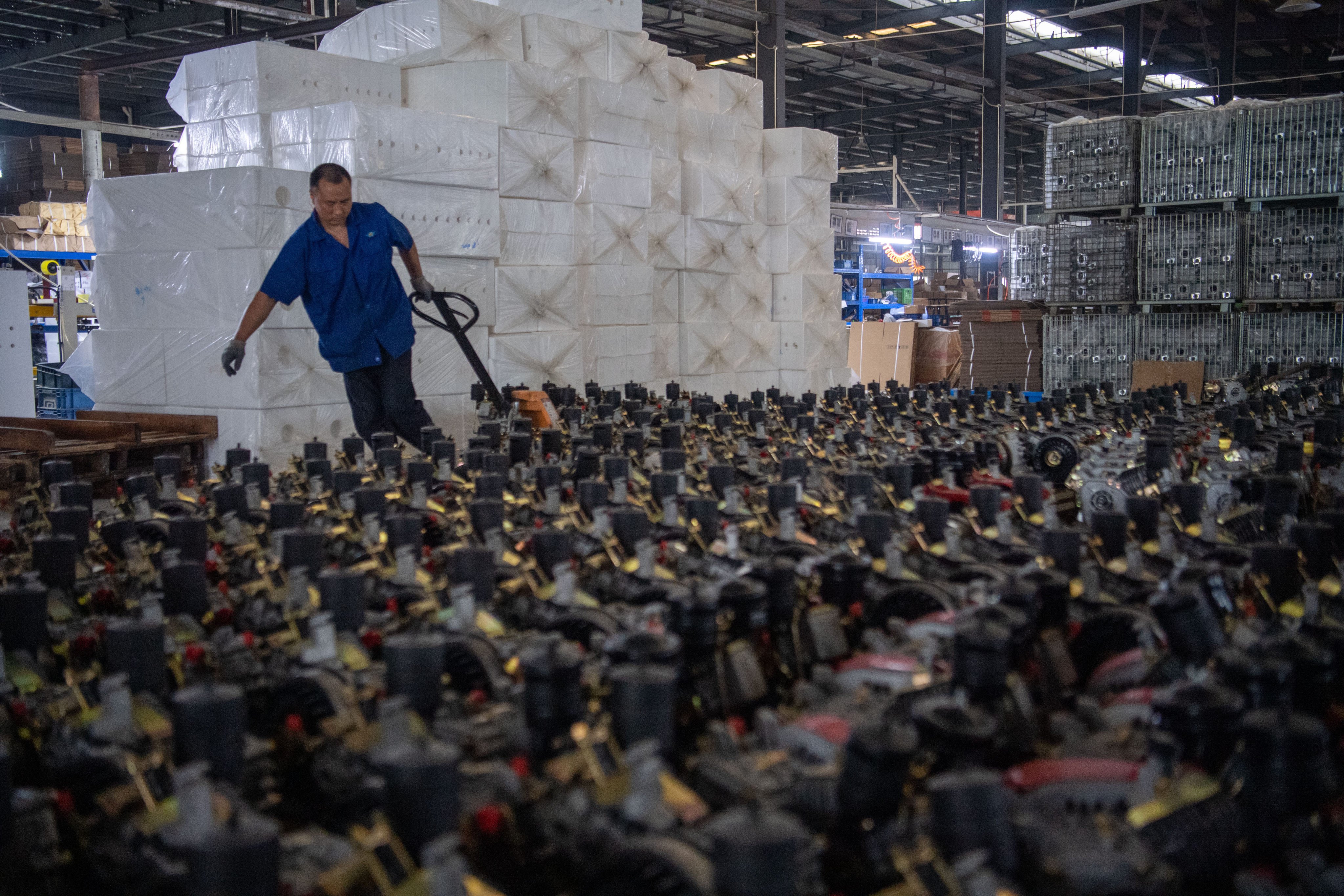 A man works at a machinery factory in southwest China’s Chongqing municipality on May 27. Inland cities such as Chongqing, Wuhan and Xian will be central to maintaining China’s growth momentum as the government tries to bring economic development to regions outside the prosperous east coast. Photo: Xinhua