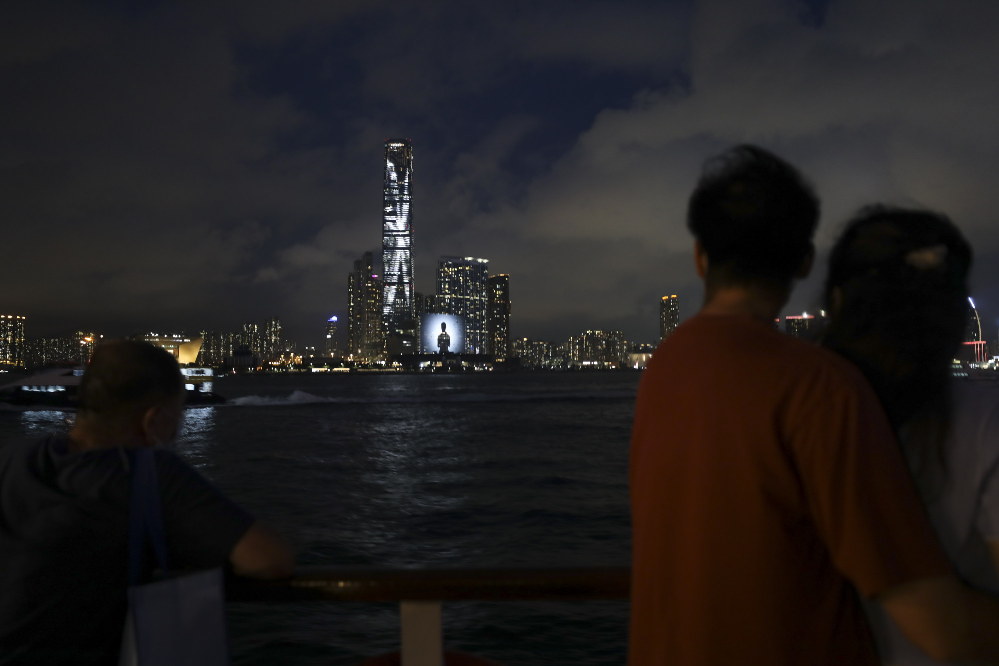 Tourists aboard the World Star enjoy a blue-hour view of West Kowloon. Photo: Xiaomei Chen