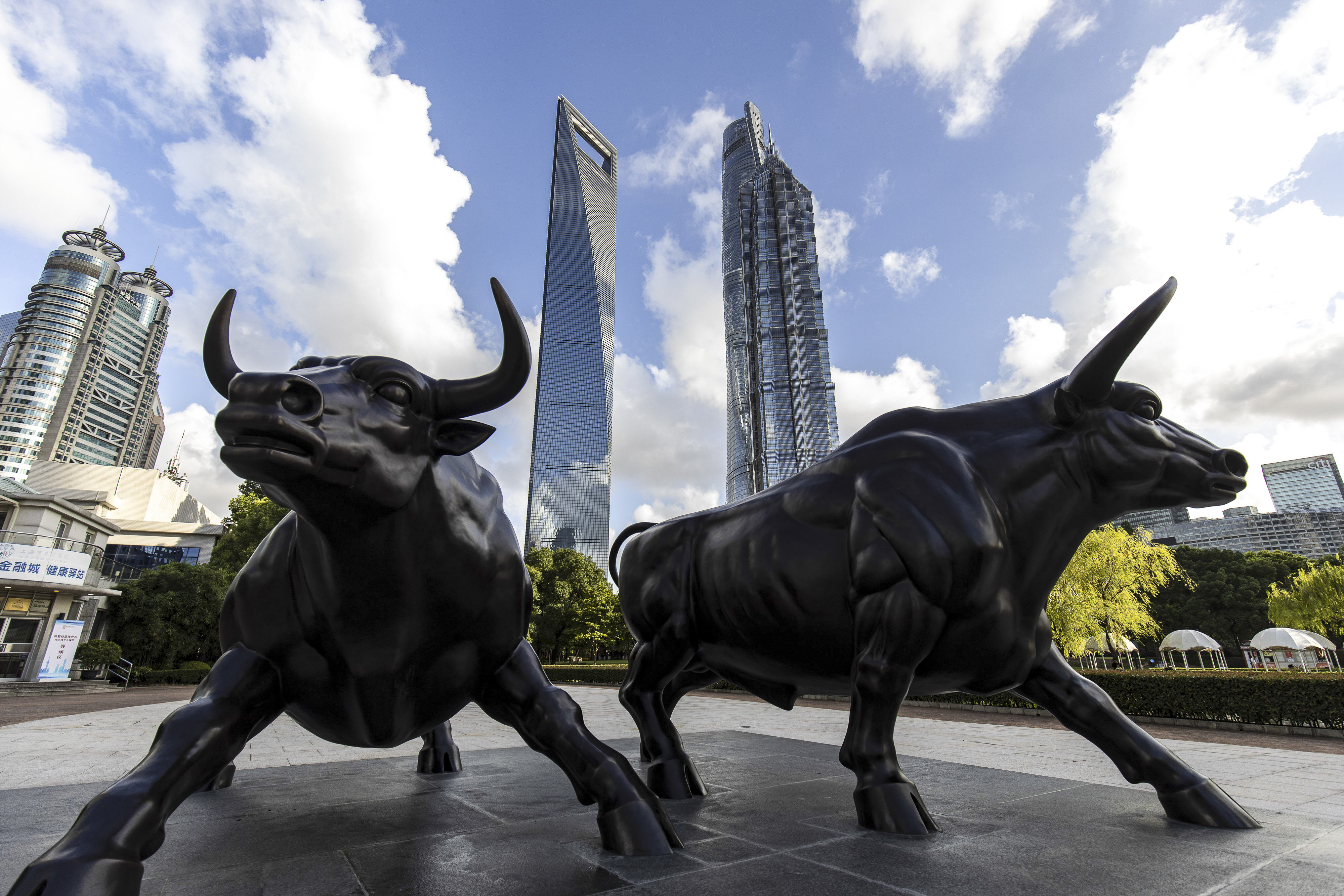 A sculpture of bulls in the Lujiazui business district in Shanghai. Chinese investment banks have grown in stature in Hong Kong as they now account for a majority of the IPO deals.  Photo: Bloomberg
