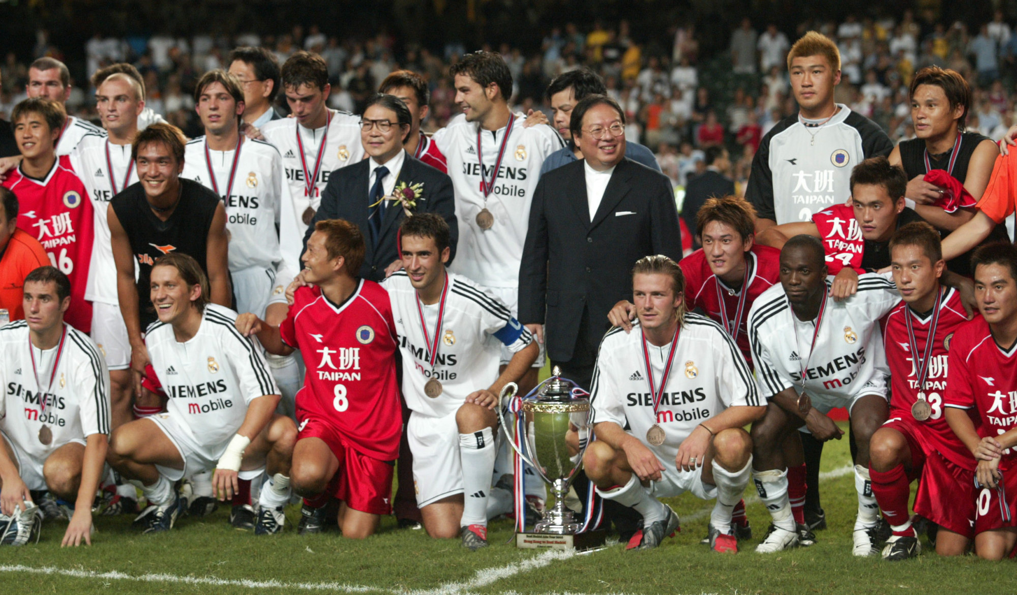 Hong Kong and Real Madrid players mix after their match at Hong Kong Stadium. Photo: David Wong