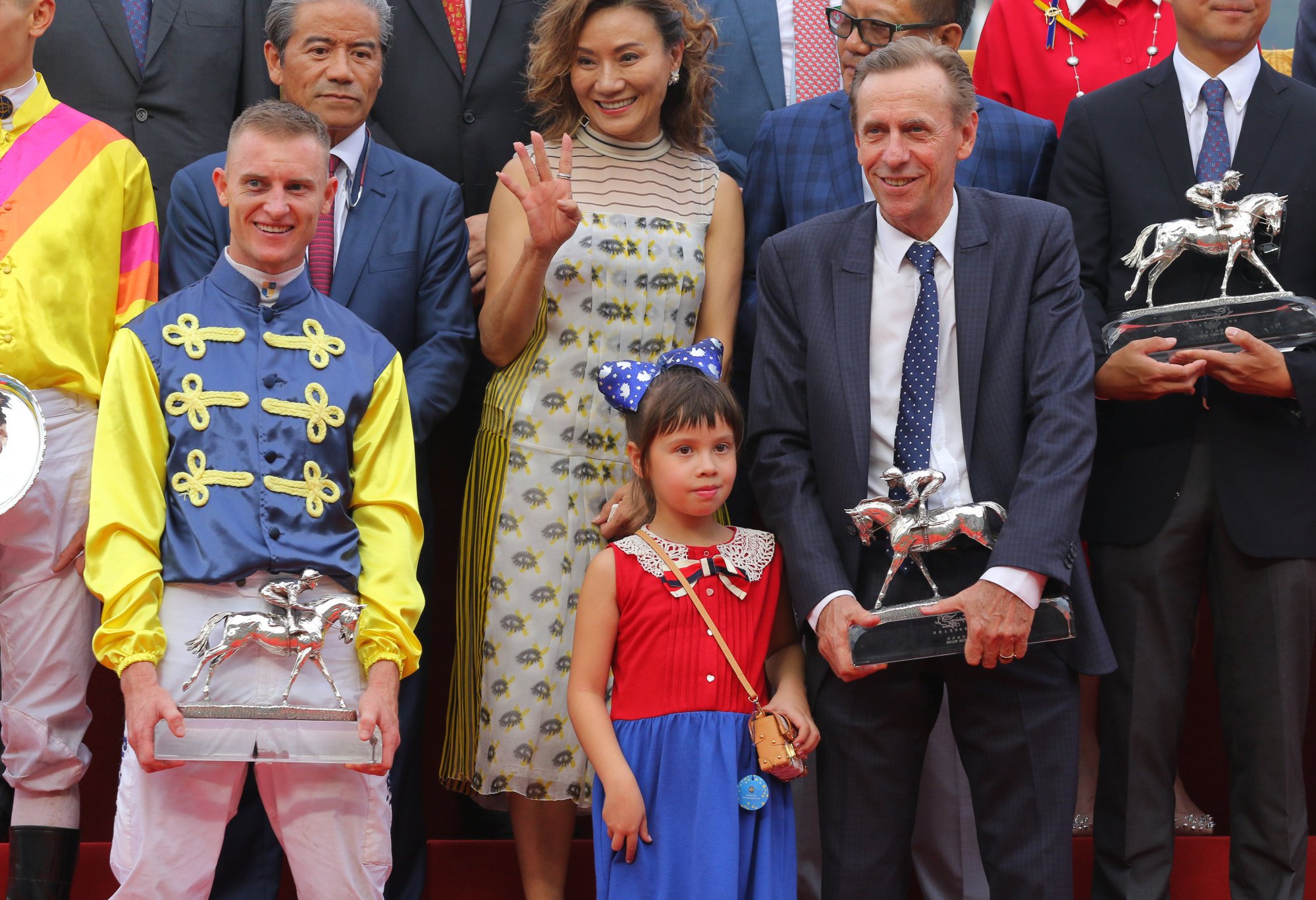 A familiar sight as Zac Purton and John Size pick up champion jockey and trainer awards.