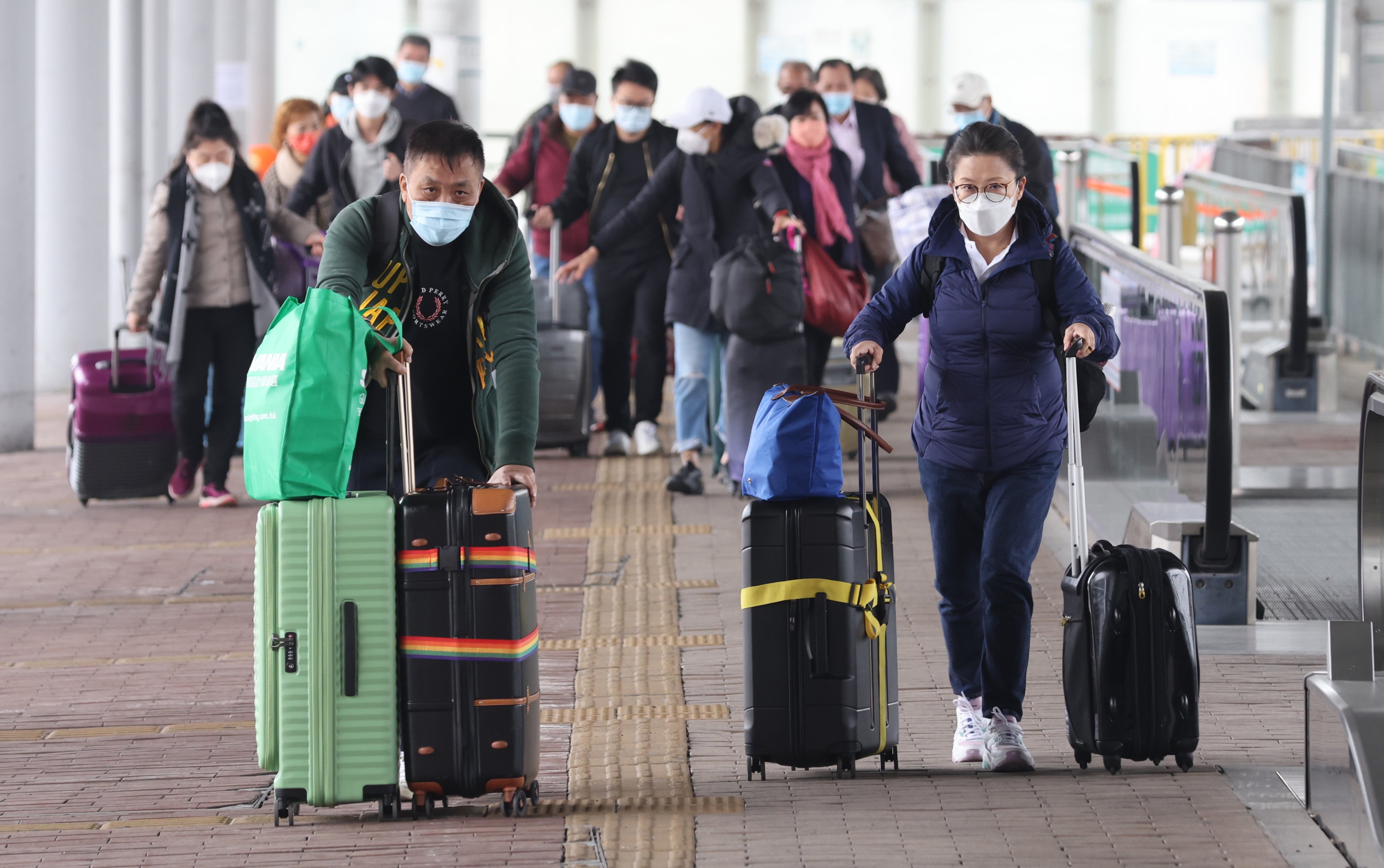 People travel across the Shenzhen Bay border on December 28, 2021. Those who have tried booking quarantine rooms across the border are likely to have encountered scalper bots. Photo: May Tse