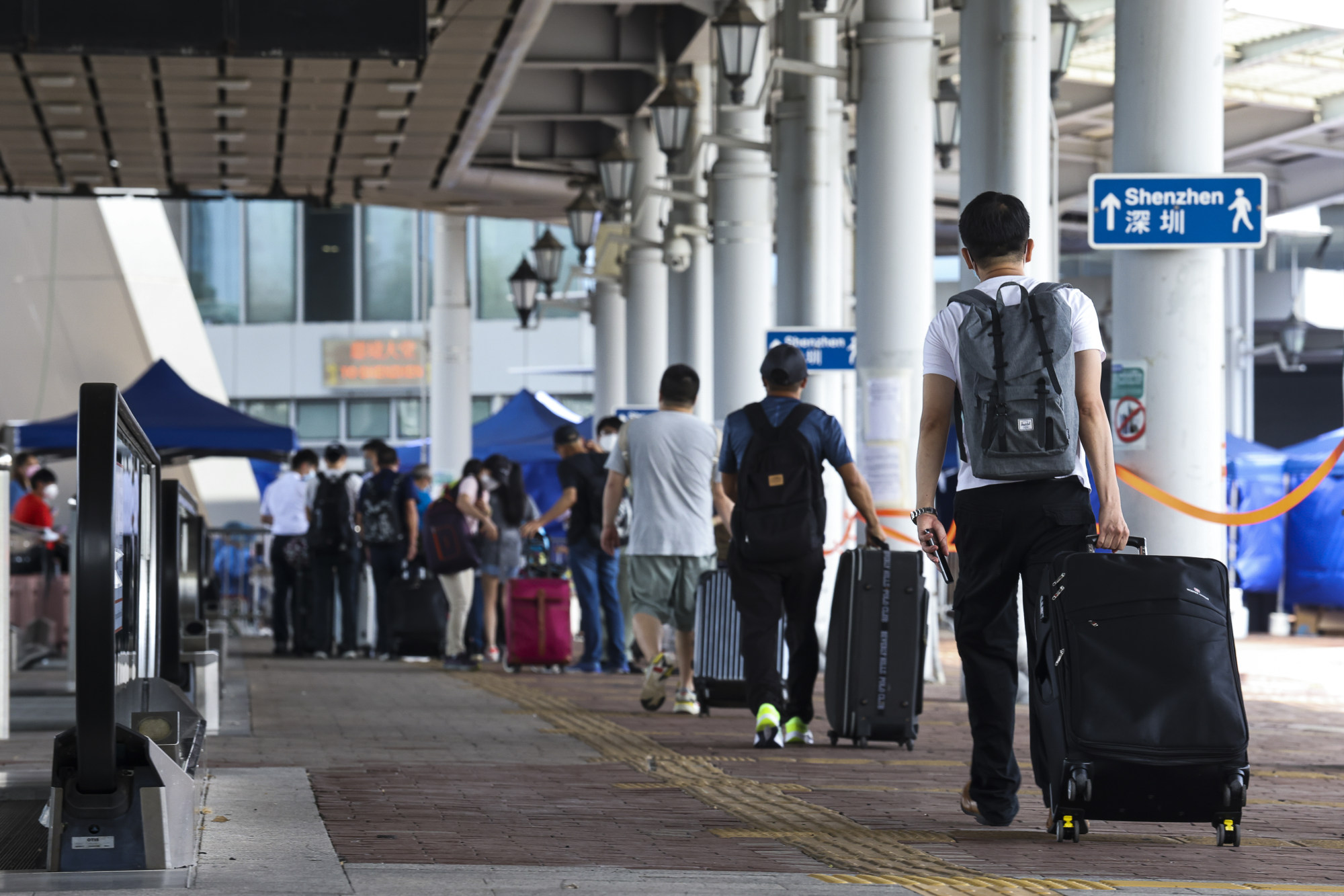 Travellers at the Shenzhen Bay border queue for Covid-19 tests. Photo: K. Y. Cheng