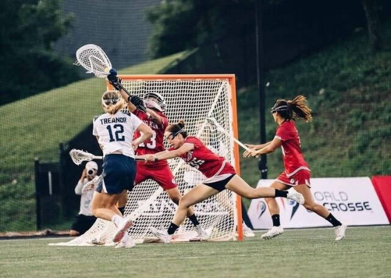 Hong Kong goalie Yue Ya-cheng saves an attempt as the US’ Kayla Treanor closes in during their game at the World Lacrosse Women’s Championship. Photo: Handout