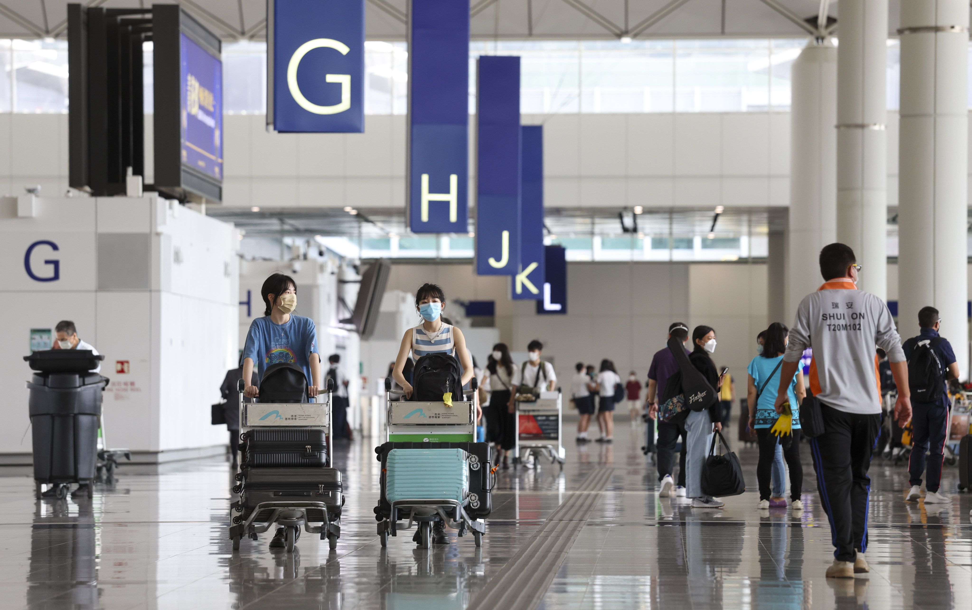 Travellers in the departure hall at Hong Kong International Airport on June 22, 2022. Photo: SCMP
