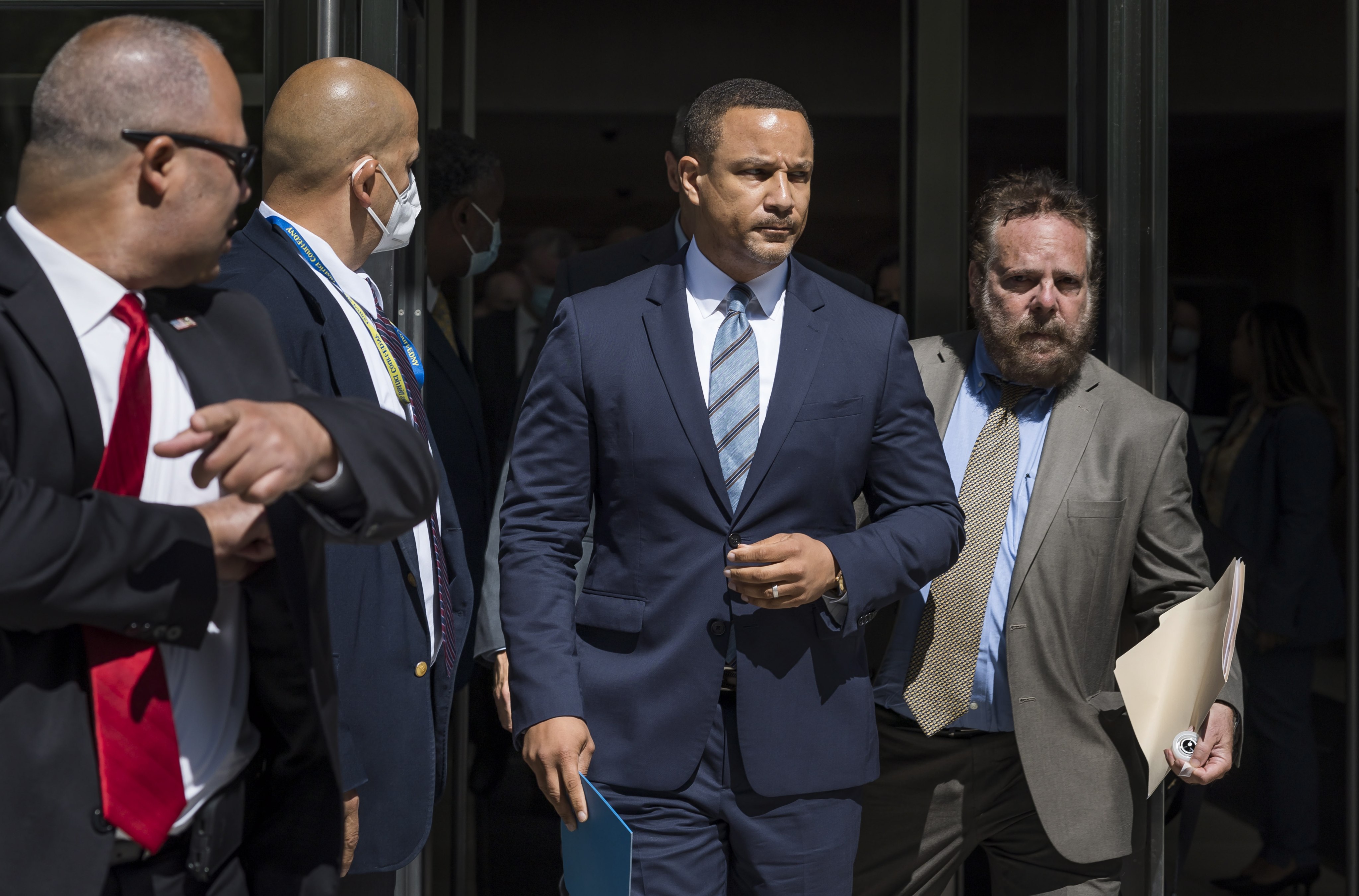 Breon Peace (centre), US Attorney for the Eastern District of New York,  outside the courthouse in Brooklyn. Peace says his office will always work to root out corrupt officials. Photo: EPA-EFE