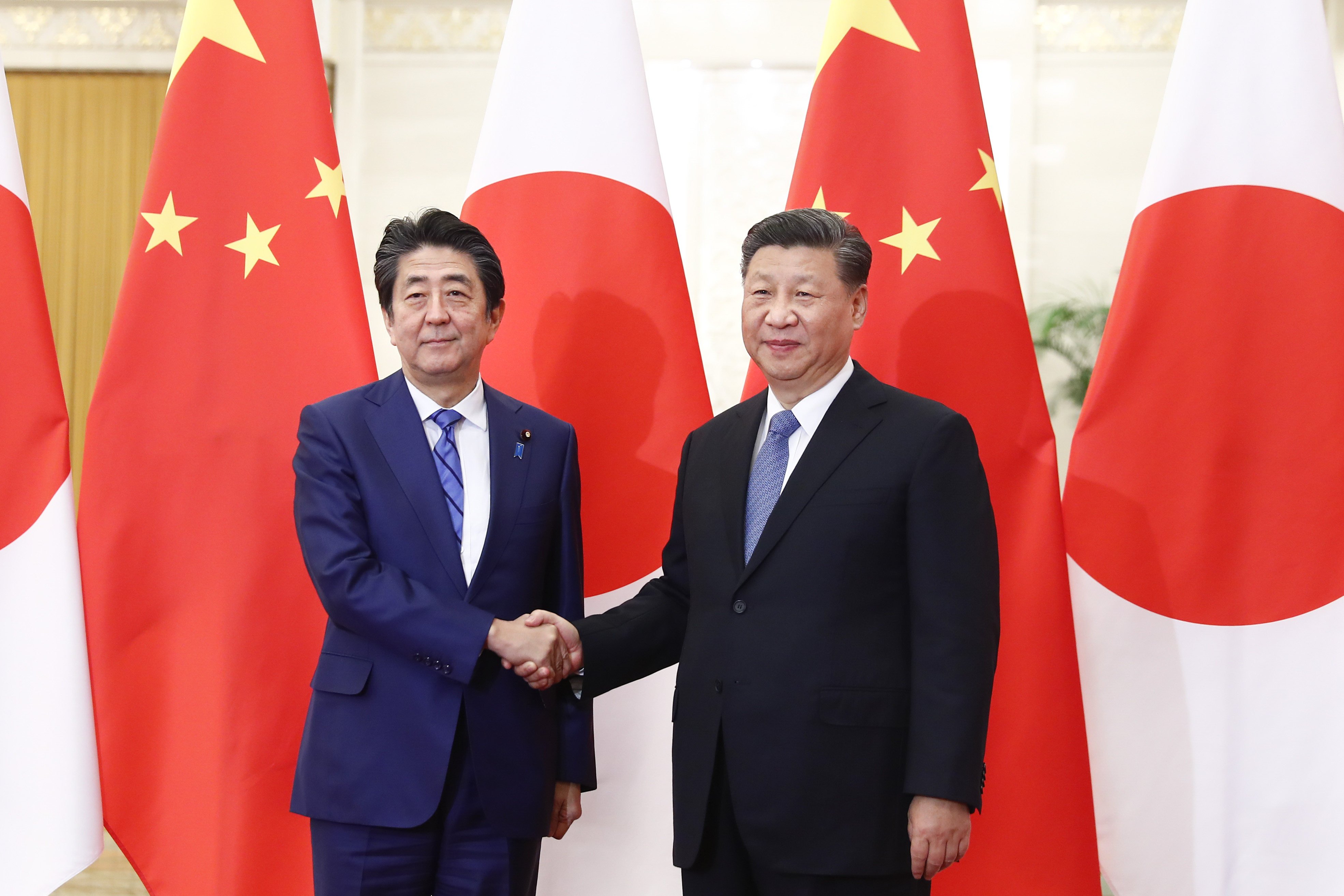 Shinzo Abe and Xi Jinping pictured in Beijing in 2019. Photo: dpa