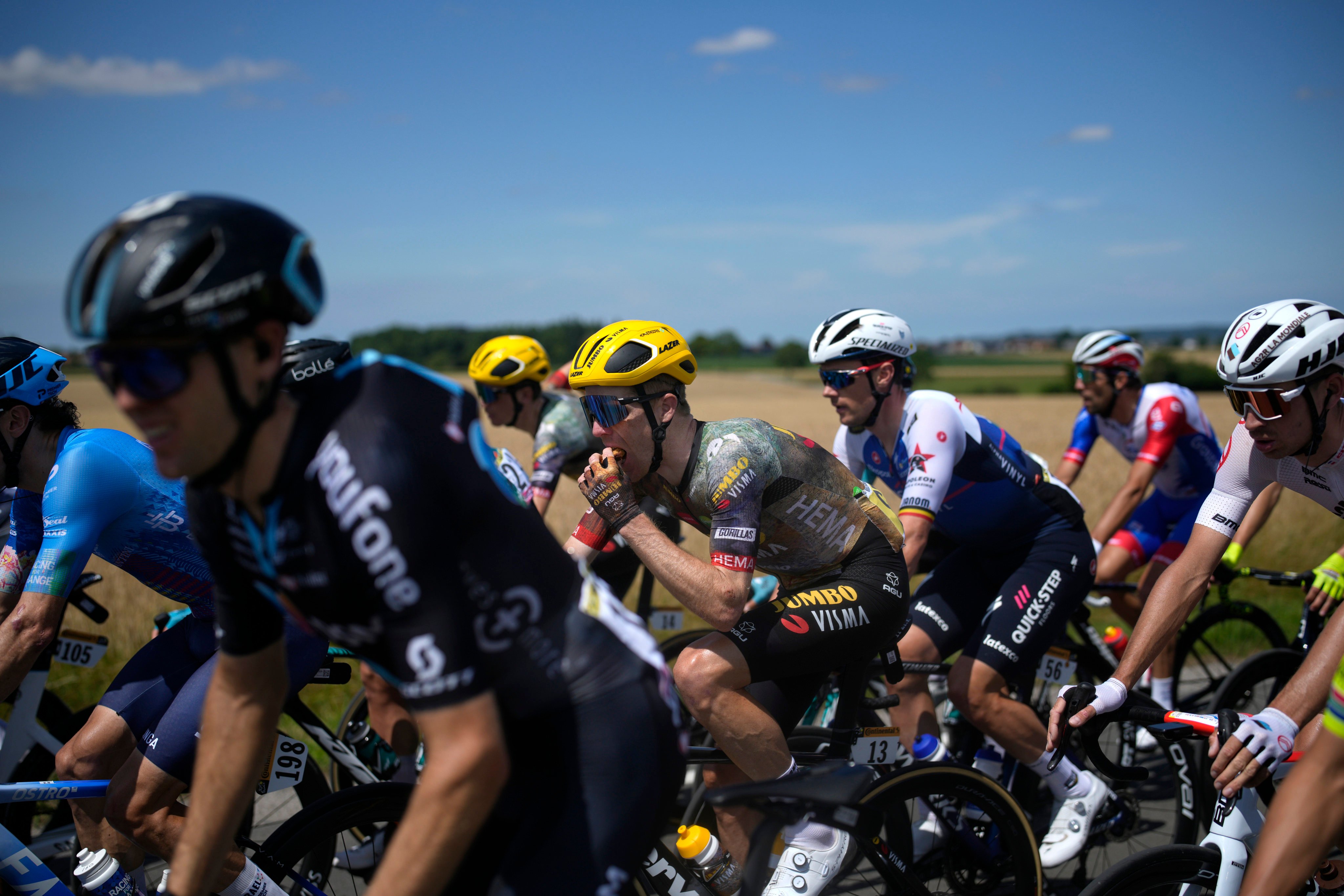 Steven Kruijswijk grabs a snack during the fourth stage of the Tour de France on Tuesday. Photo: AP