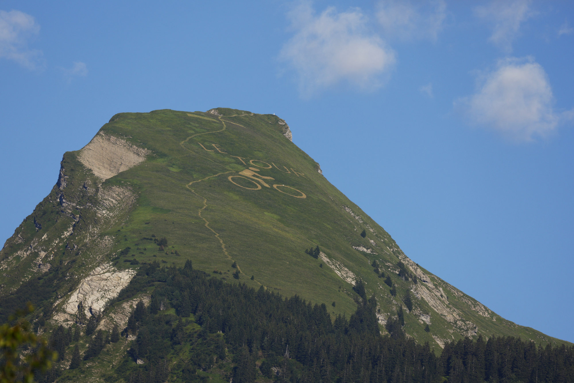 A Tour de France logo seen on a mountain peak in Morzine during stage nine. Photo: Reuters