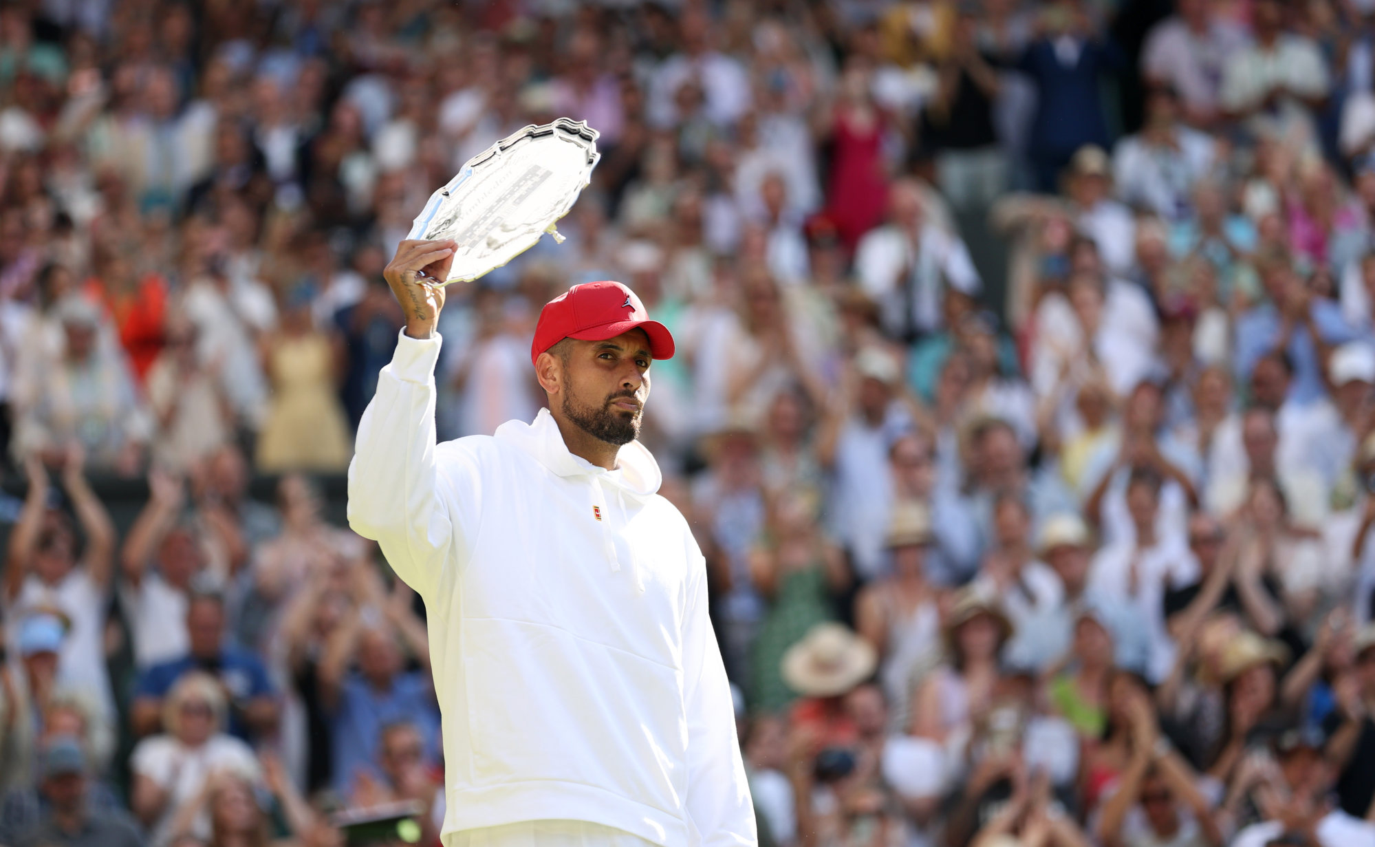 Nick Kyrgios with the runner-up trophy. Photo: Xinhua