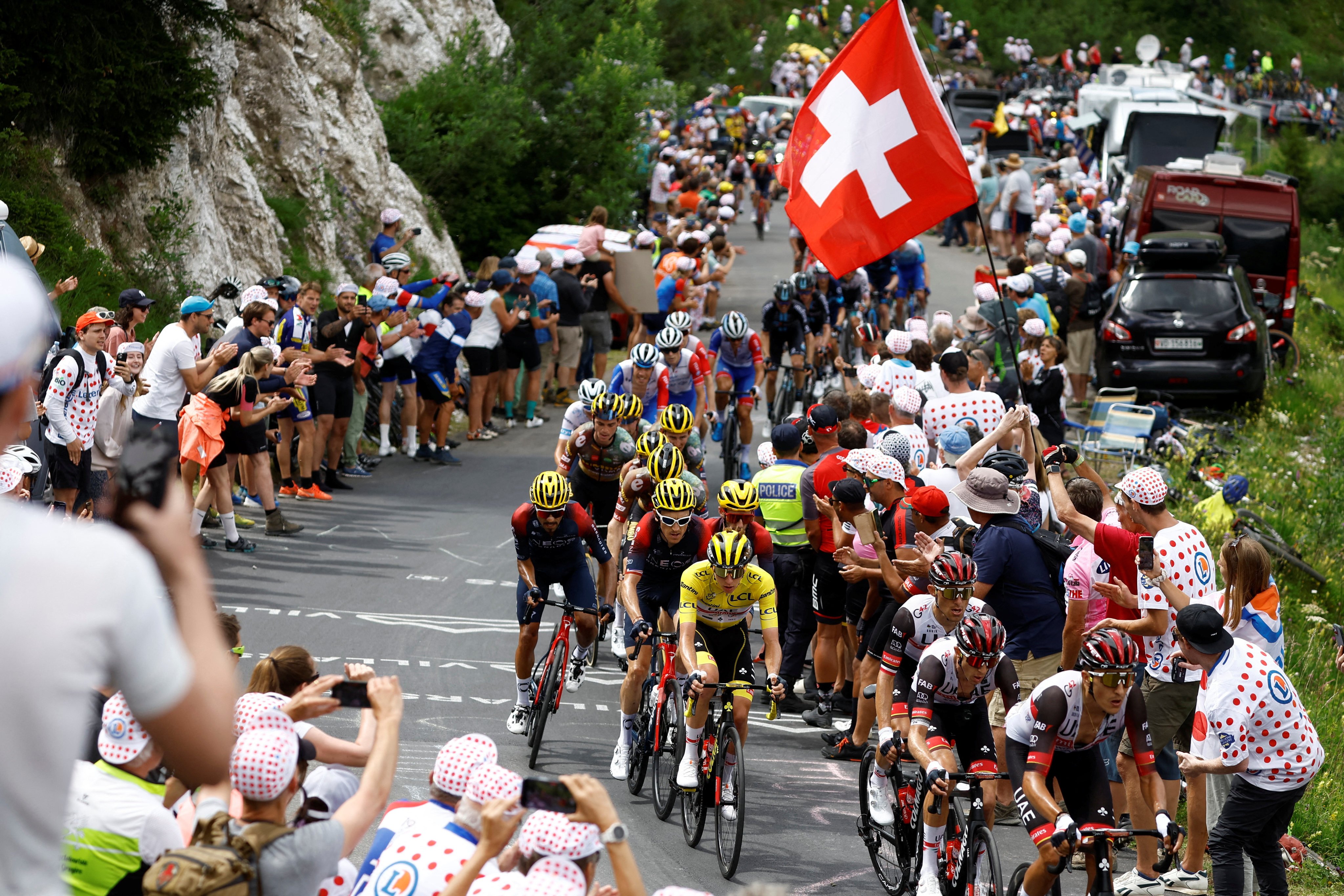 Tadej Pogacar wearing the overall leader’s yellow jersey makes his way from Aigle to Chatel les Portes du Soleil on stage nine of the Tour de France. Photo: Reuters