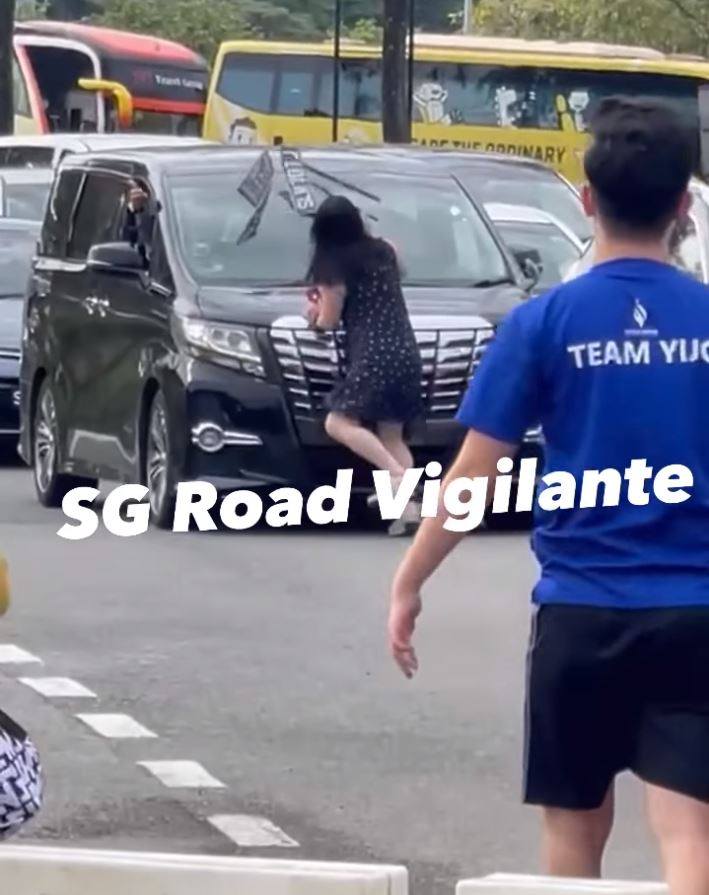 Footage of the Saturday incident on Tuas Second Link showed a woman prying off a number plate with her bare hands before hurling it at the car’s windscreen. Photo: Facebook / SGRVigilante