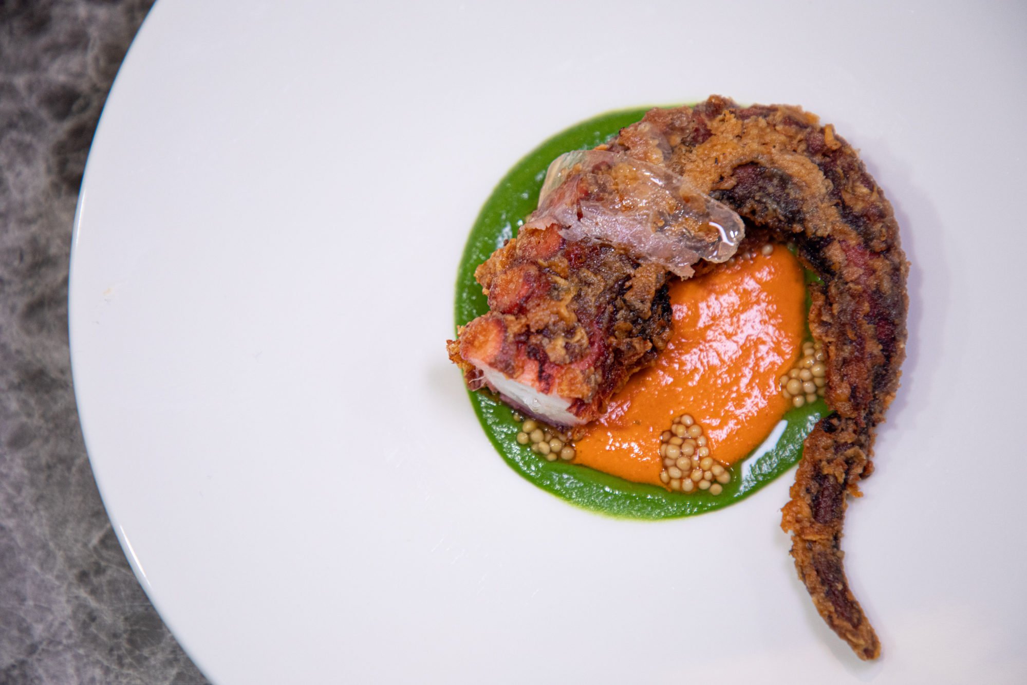 Fried octopus, watercress purée and mojo rojo sauce at Netta. Photo: Netta
