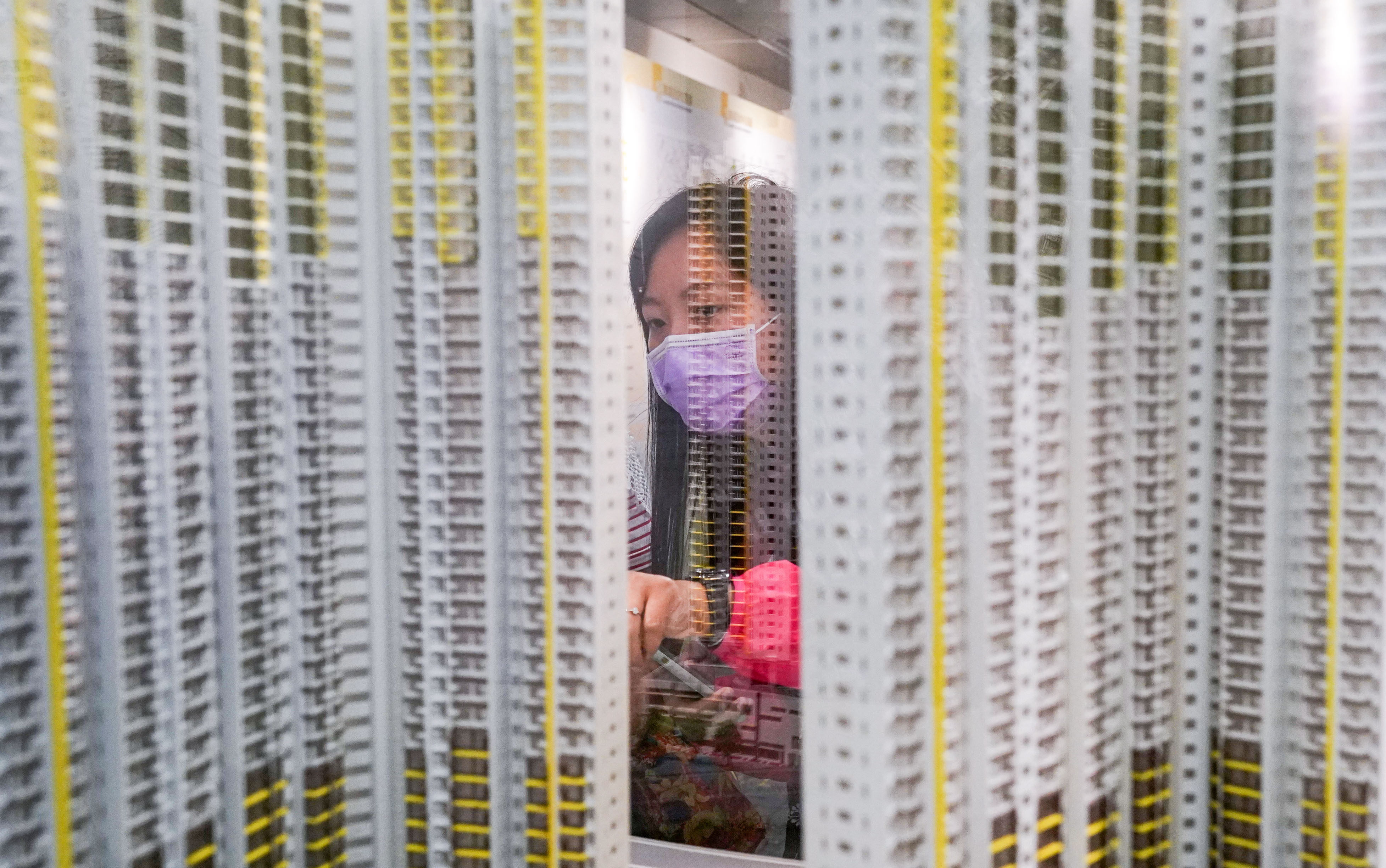 A potential homebuyer views a model at the Housing Authority’s Home Ownership Scheme Sales Unit in Kwun Tong district, in this file photo from August 2020. Photo: Felix Wong