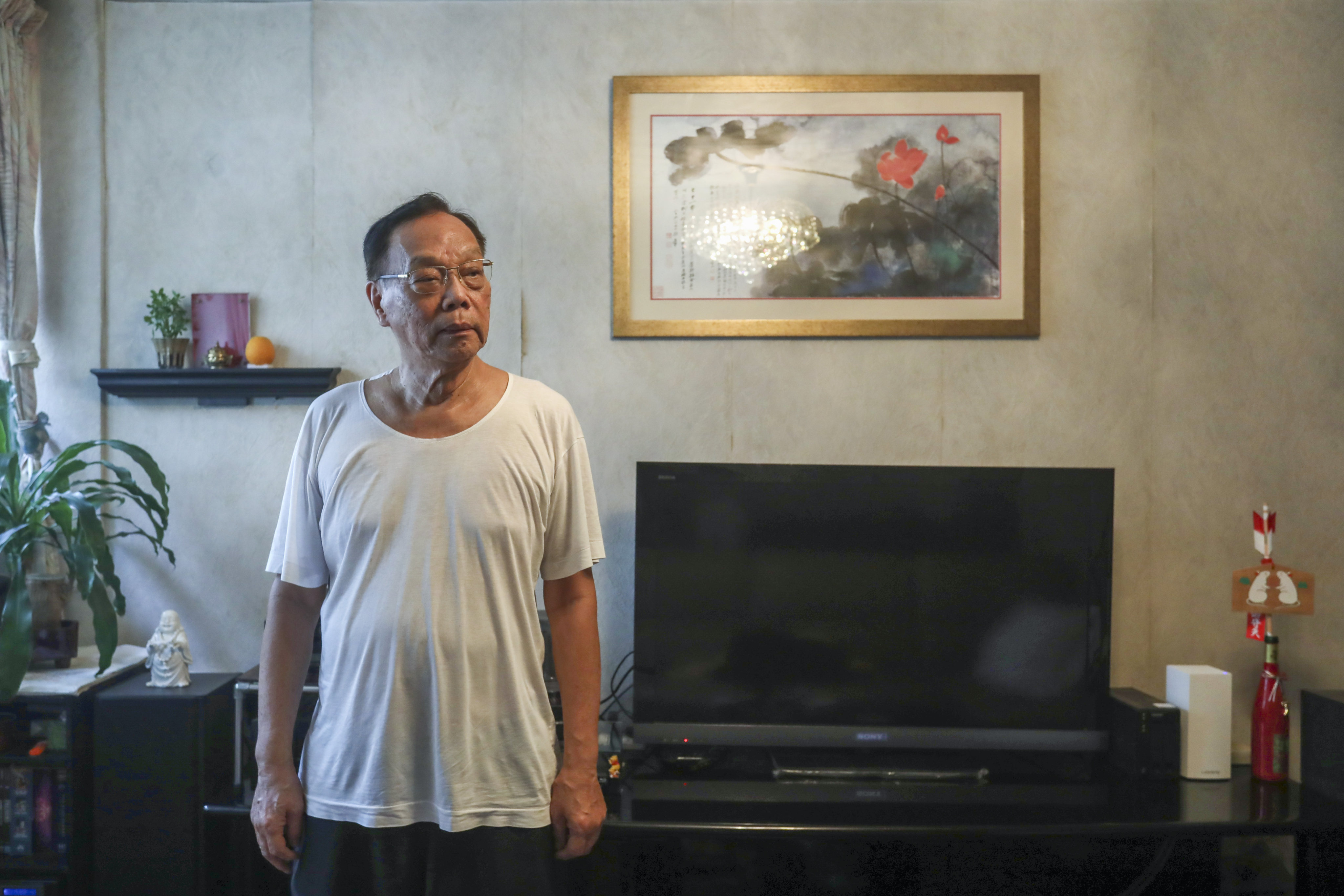 Tsang Yuk-kwan, 82, pictured on July 7, 2022, in his 940 sq ft flat in Cheung Sha Wan, which he bought in 1970 under the Civil Servants’ Co-operative Building Society Scheme. Photo: SCMP / Jonathan Wong